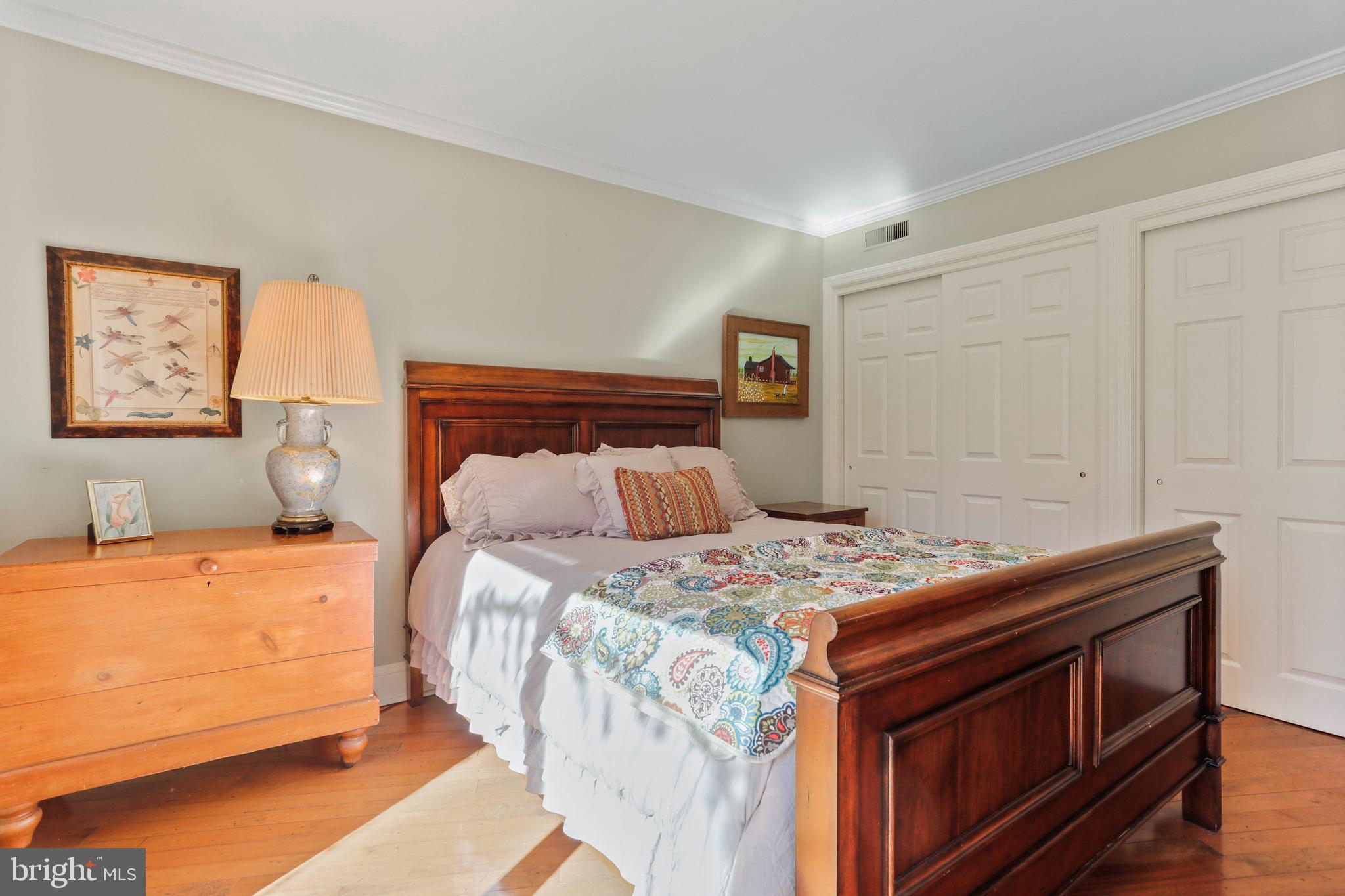 305 College Place Frederick, MD 21701 - Photo 27 of 71 a bedroom with a bed and a dresser