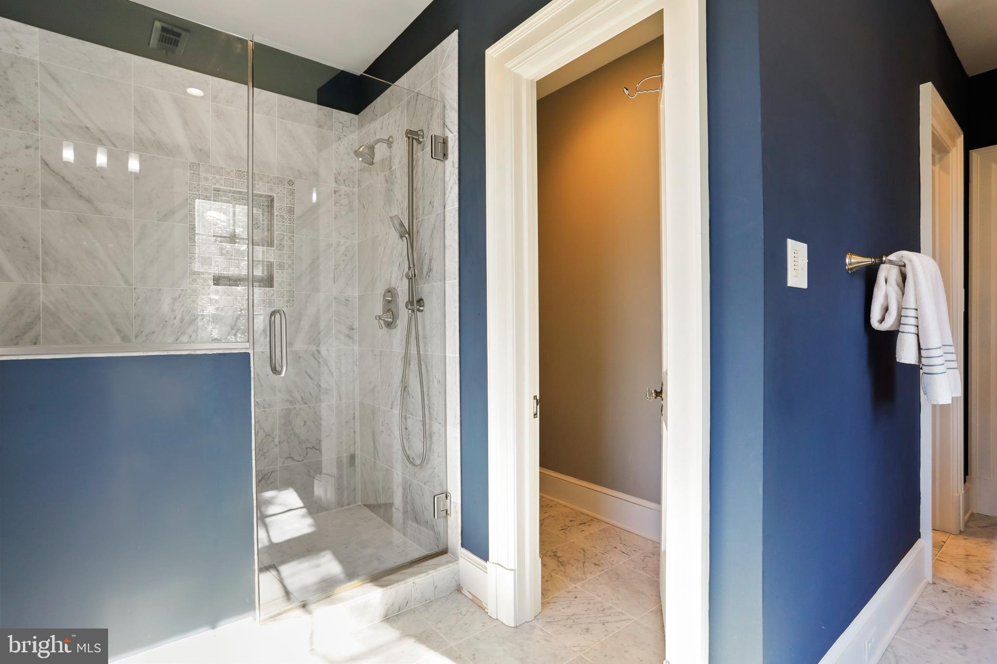 305 College Place Frederick, MD 21701 - Photo 36 of 71 a bathroom with a glass shower door