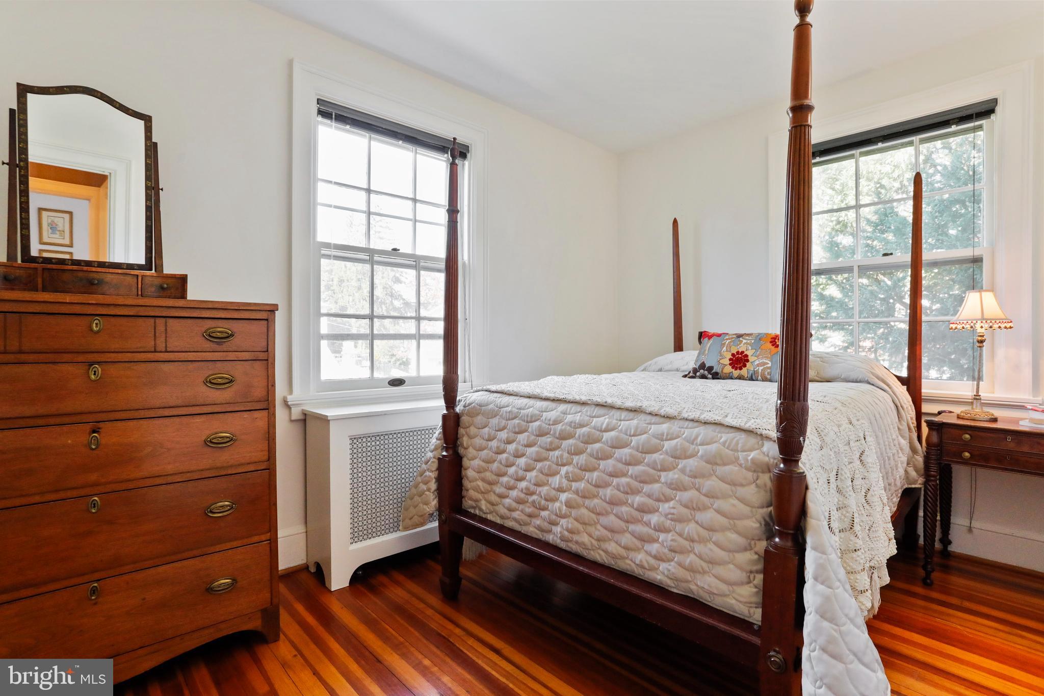 305 College Place Frederick, MD 21701 - Photo 38 of 71 a bed sitting in a bedroom next to a window