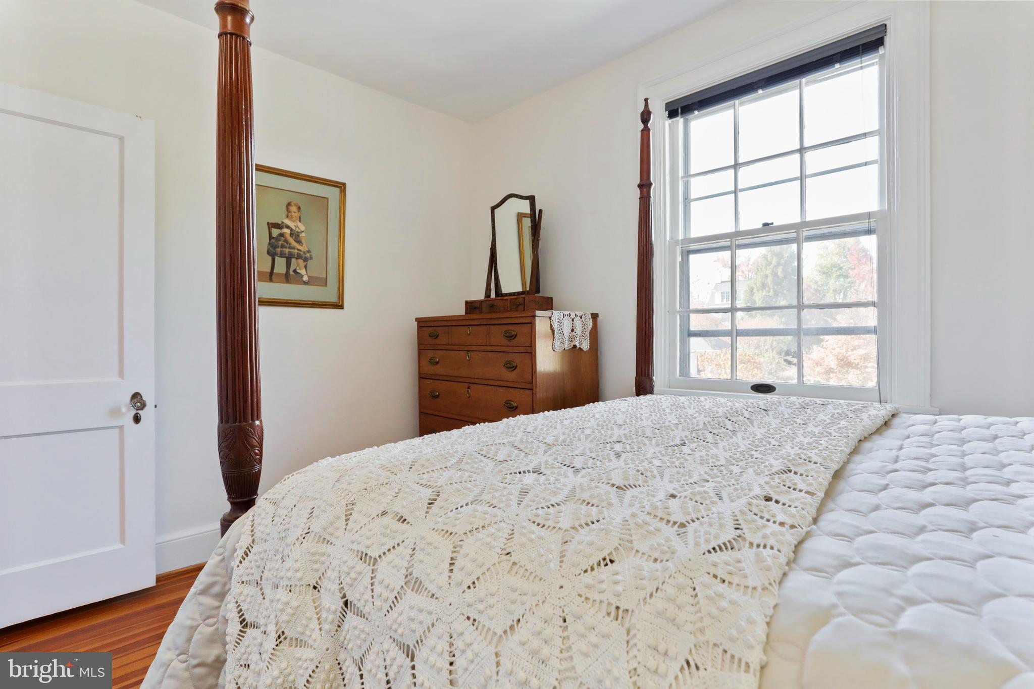 305 College Place Frederick, MD 21701 - Photo 40 of 71 a bedroom with a bed and a window with chair