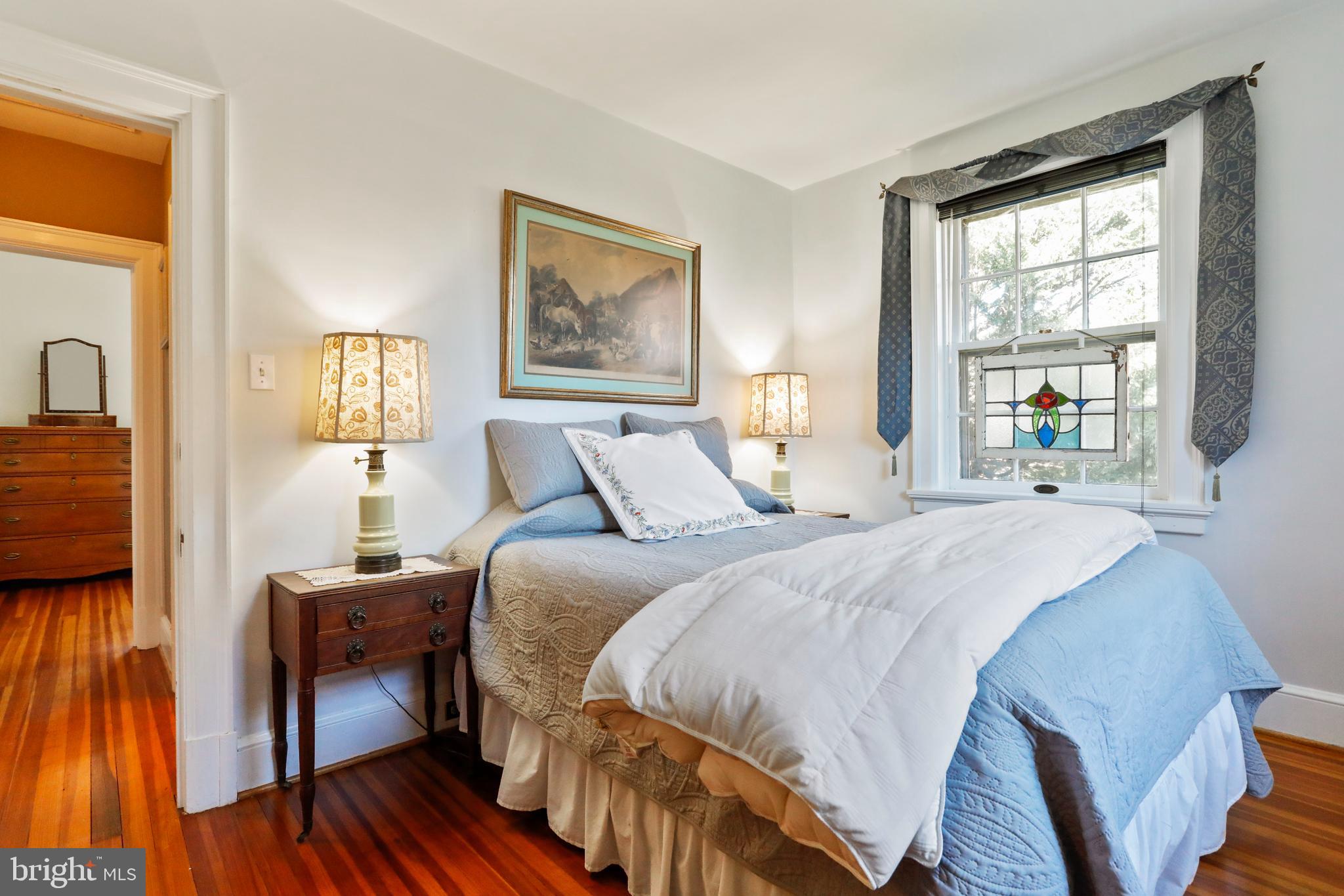 305 College Place Frederick, MD 21701 - Photo 41 of 71 a bedroom with a bed and a window