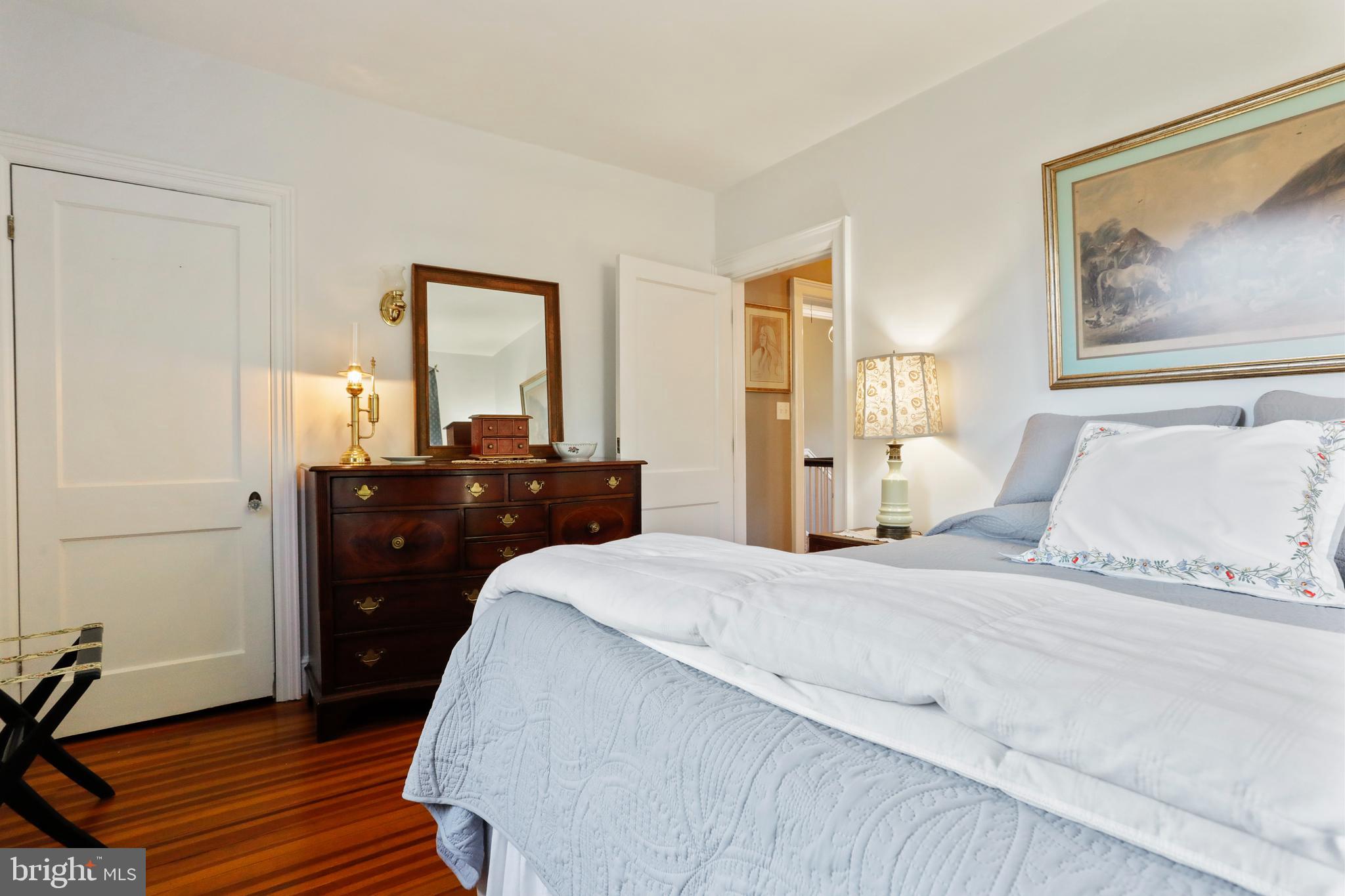 305 College Place Frederick, MD 21701 - Photo 42 of 71 a bedroom with a bed and wooden floor