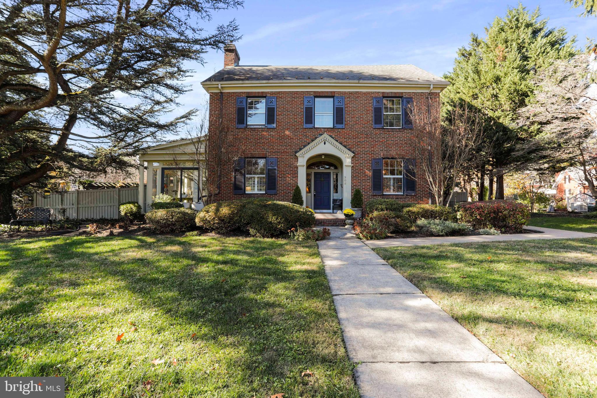 305 College Place Frederick, MD 21701 - Photo 5 of 71 a front view of a house with a yard