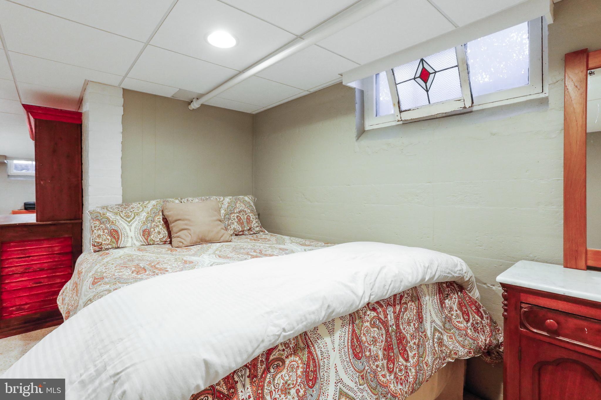 305 College Place Frederick, MD 21701 - Photo 51 of 71 a bedroom with a bed and a couch