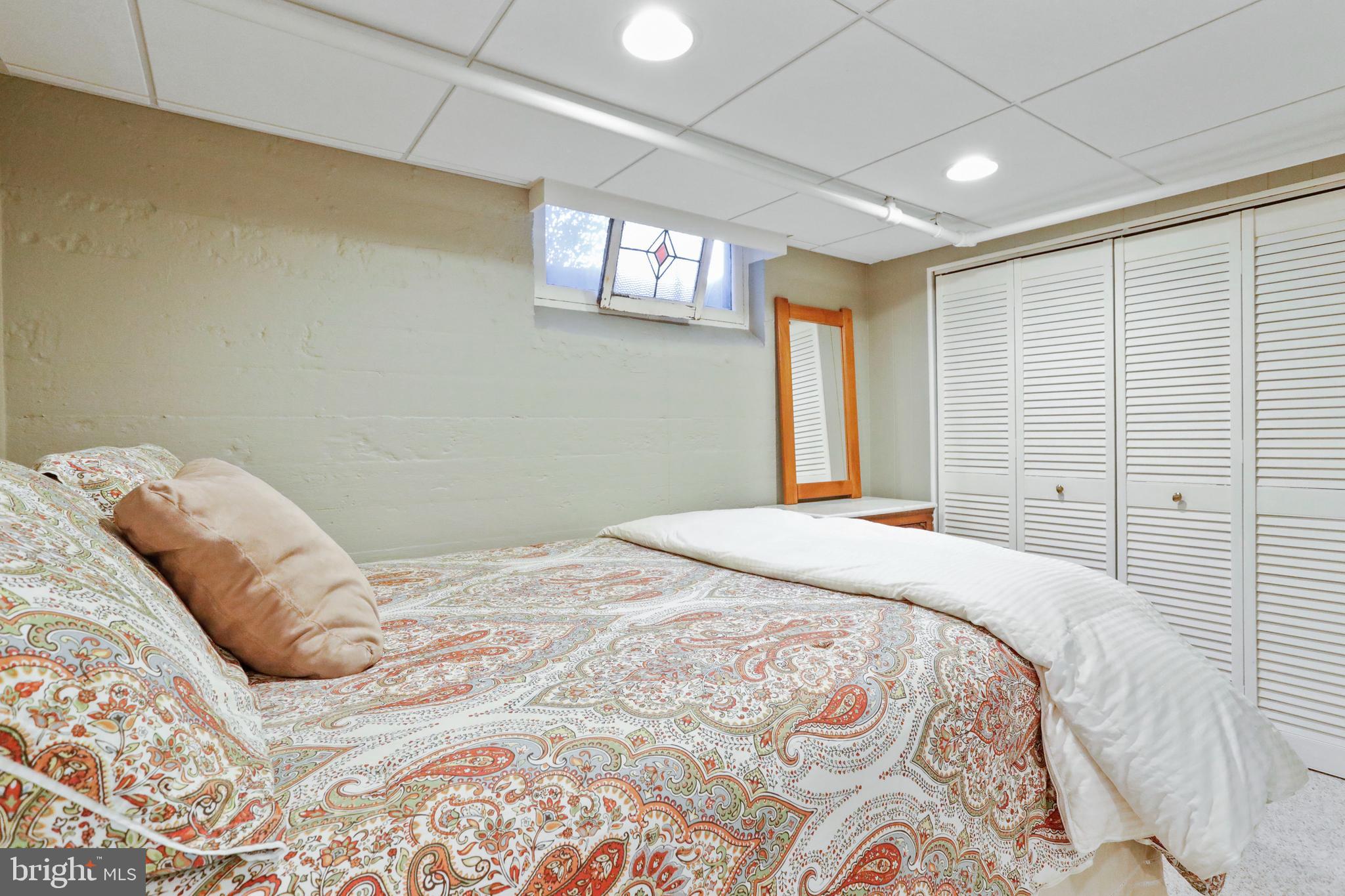 305 College Place Frederick, MD 21701 - Photo 52 of 71 a bedroom with a large bed and a window