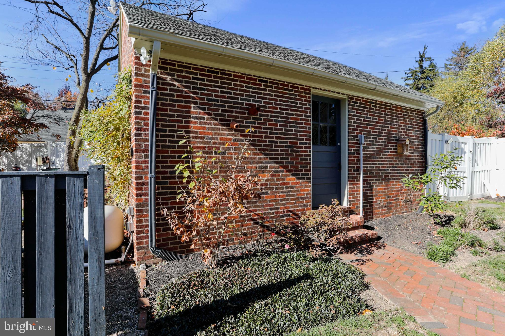 305 College Place Frederick, MD 21701 - Photo 60 of 71 a front view of a house with a garden