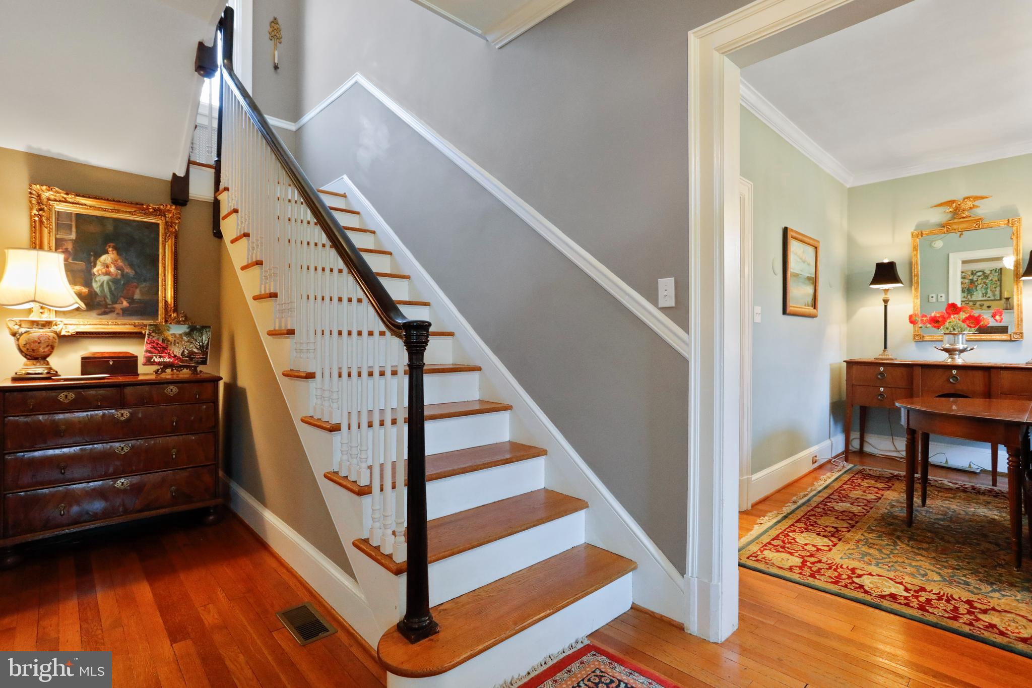 305 College Place Frederick, MD 21701 - Photo 8 of 71 a view of entryway dining room and hall with wooden floor