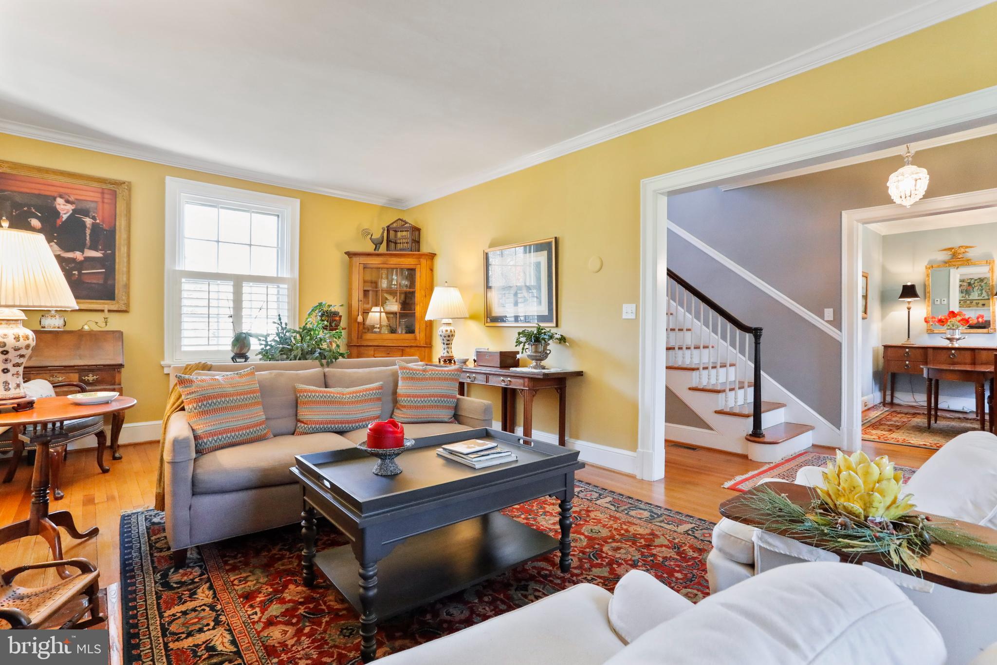 305 College Place Frederick, MD 21701 - Photo 10 of 71 a living room with furniture and a floor to ceiling window