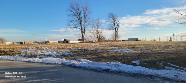 a view of a backyard of the house