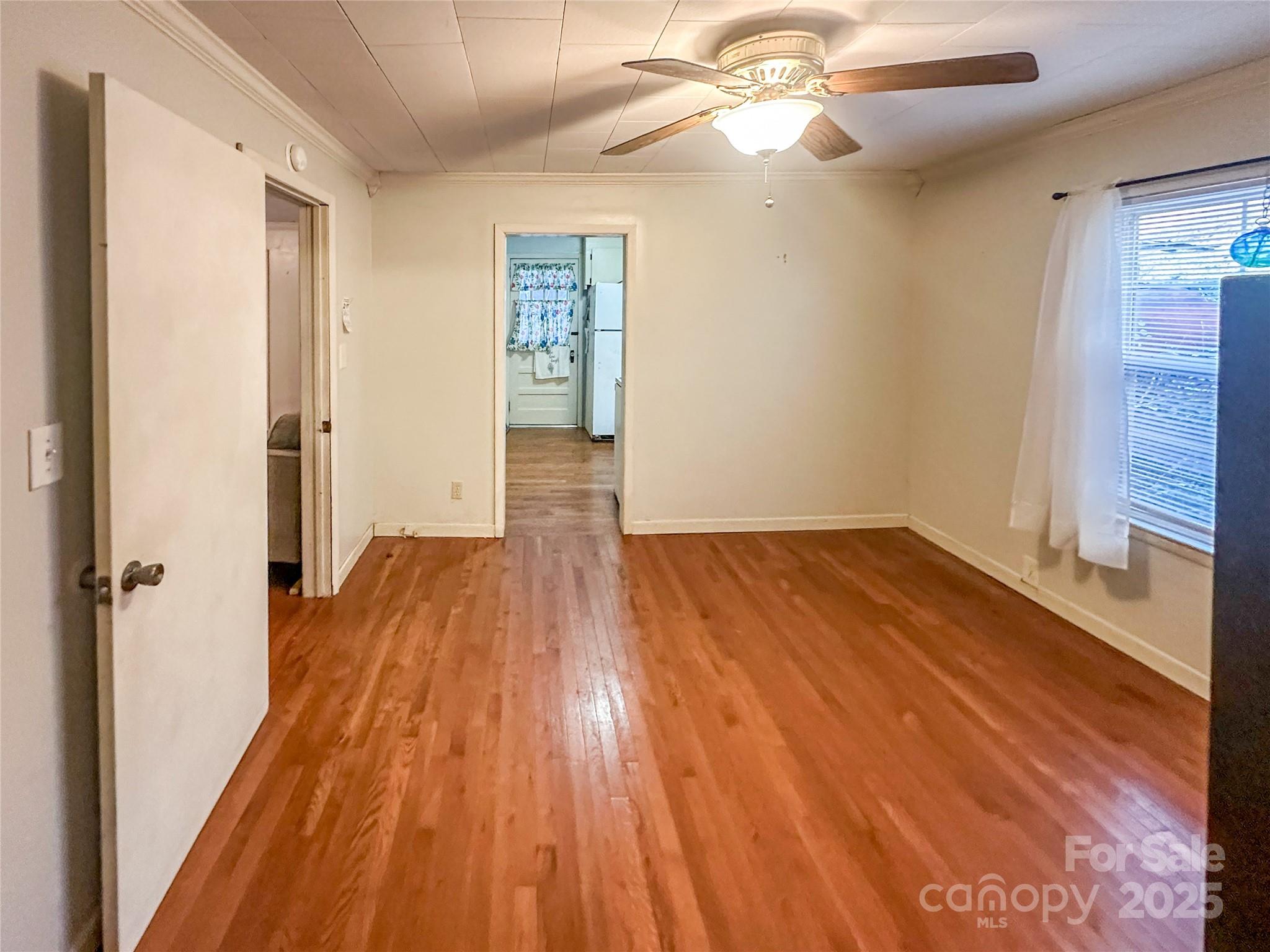 2812 Bald Mountain Road Burnsville, NC 28714 - Photo 23 of 38 wooden floor in an empty room with a window