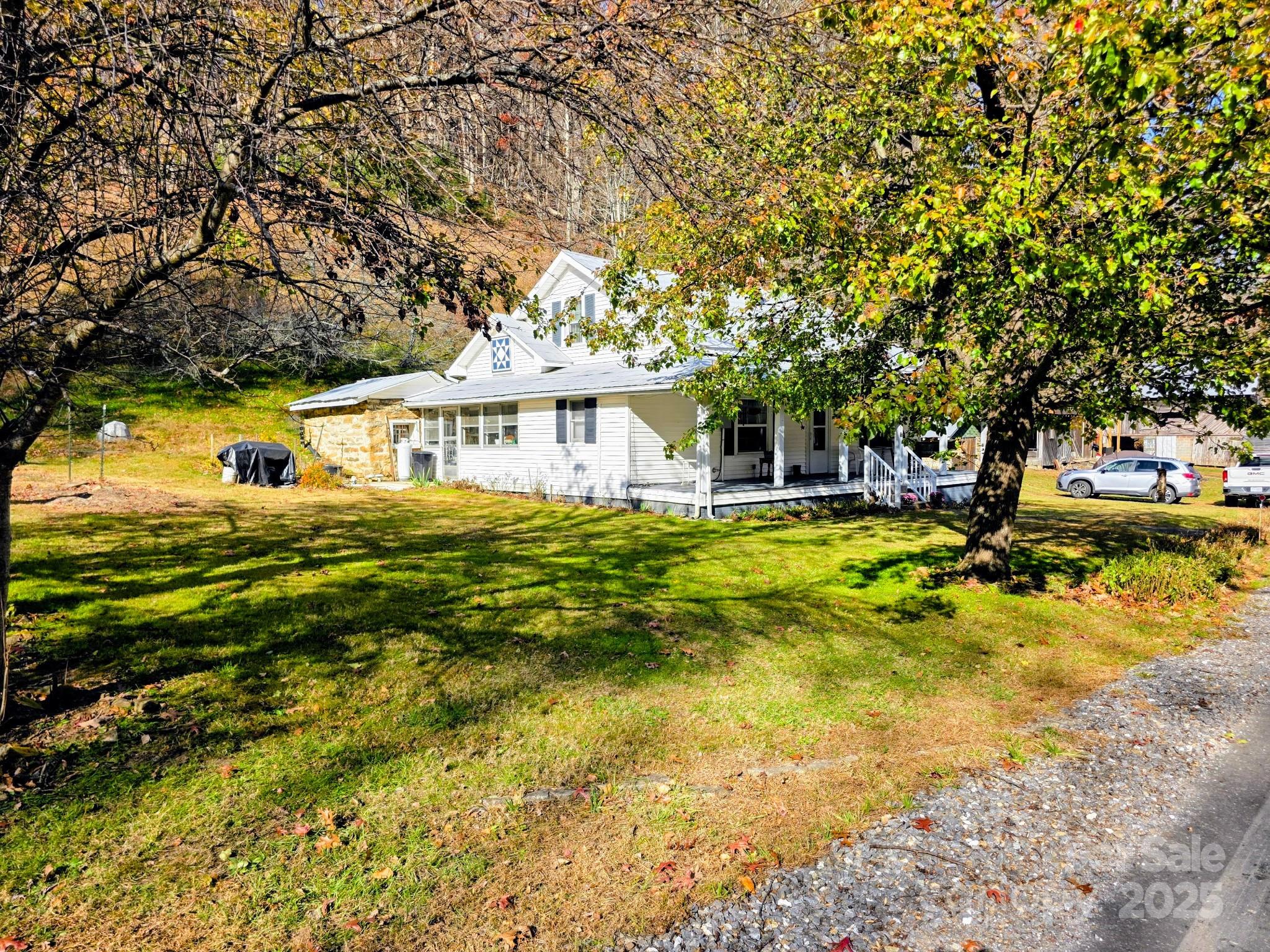 2812 Bald Mountain Road Burnsville, NC 28714 - Photo 6 of 38 a view of a house with a big yard