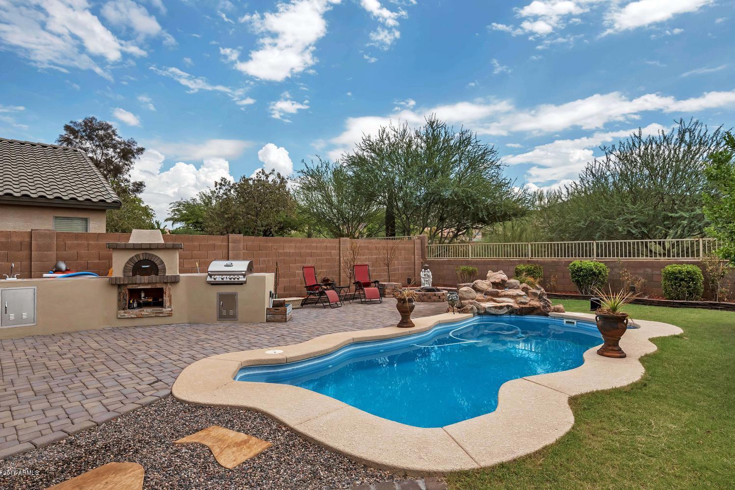 28615 North Nobel Road Phoenix, AZ 85085 - Photo 1 of 27 a swimming pool with chairs
