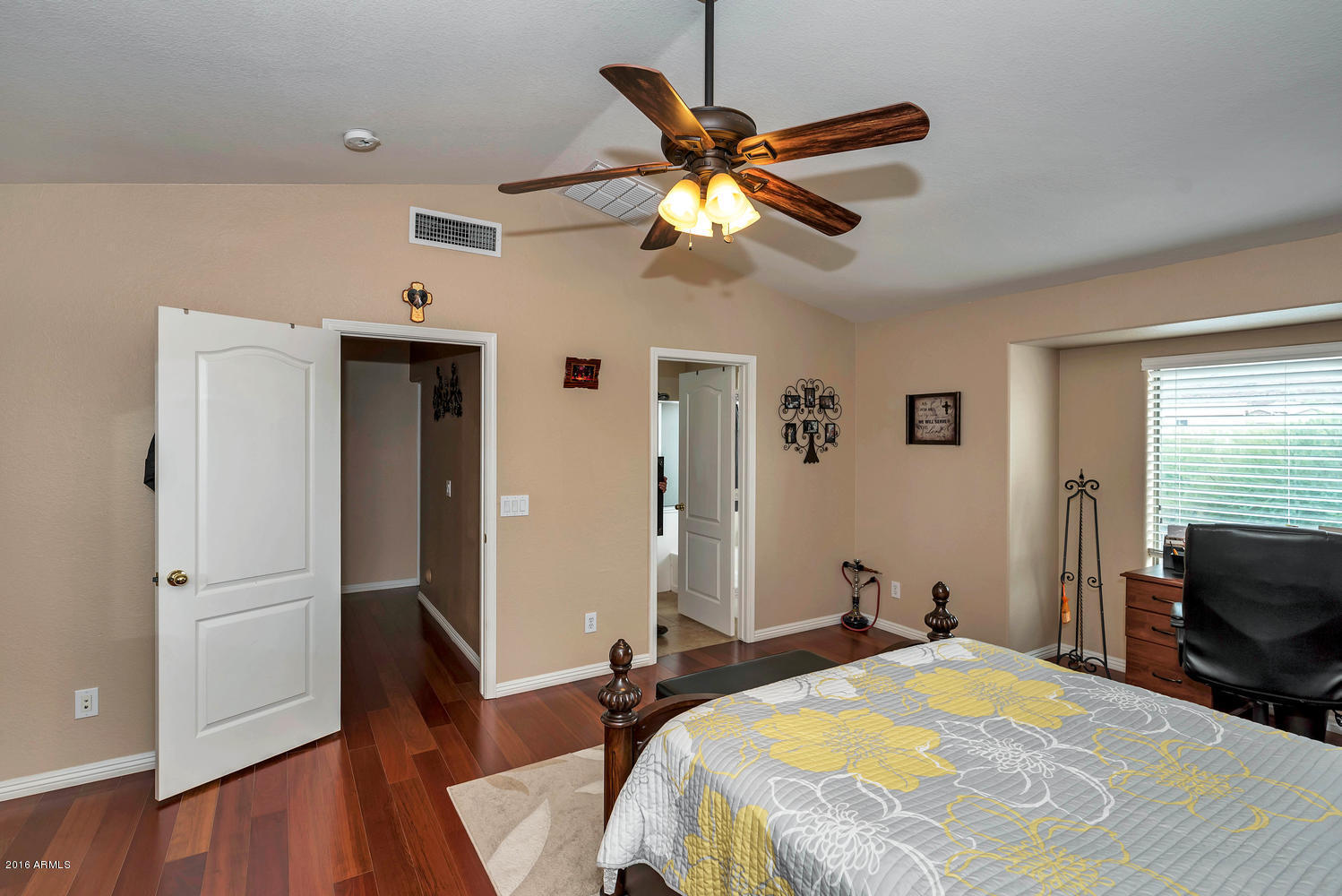 28615 North Nobel Road Phoenix, AZ 85085 - Photo 13 of 27 a bedroom with a bed and wooden floor