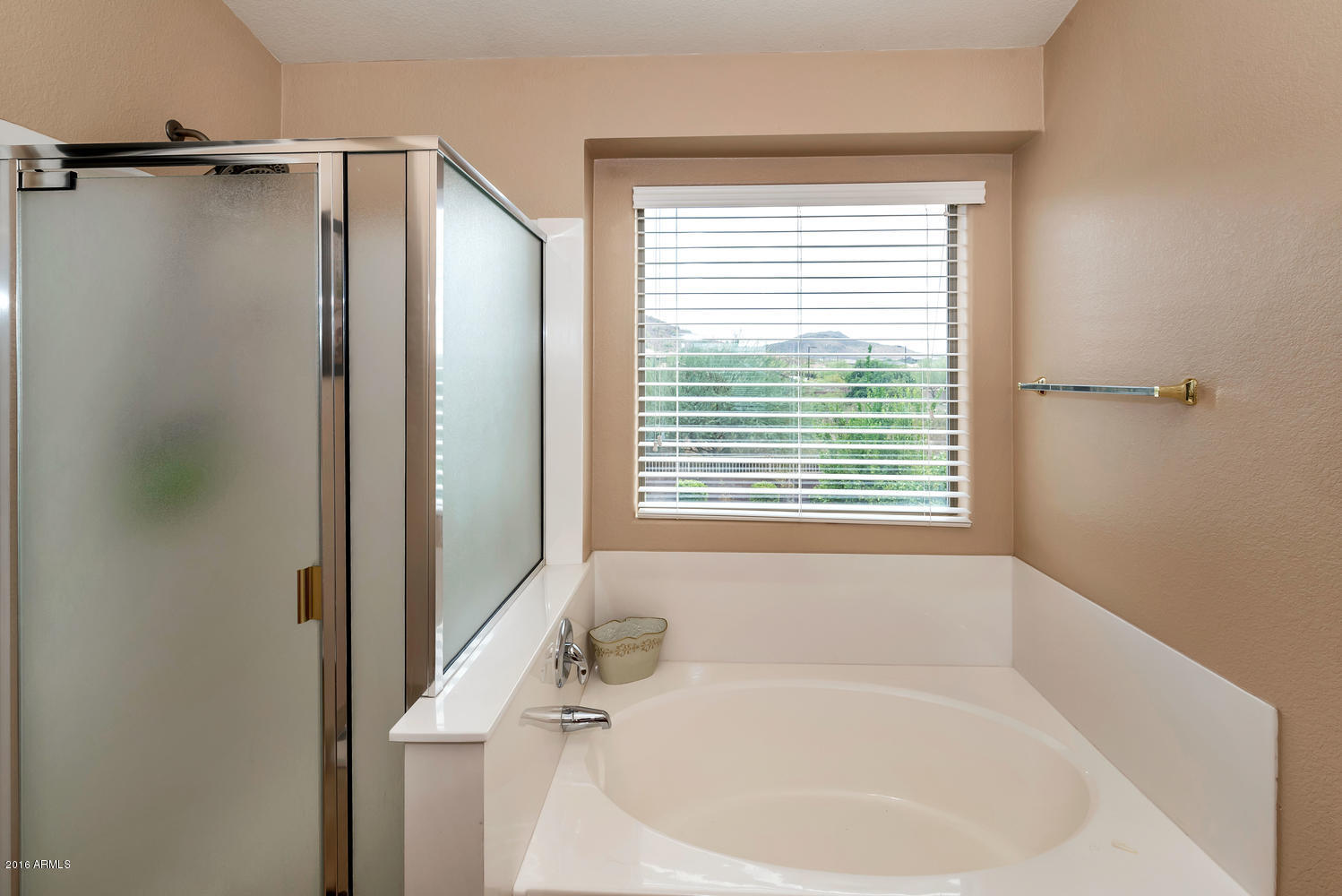 28615 North Nobel Road Phoenix, AZ 85085 - Photo 15 of 27 a white bath tub sitting next to a window