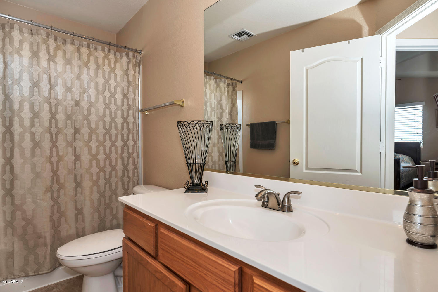 28615 North Nobel Road Phoenix, AZ 85085 - Photo 19 of 27 a bathroom with a sink toilet and shower