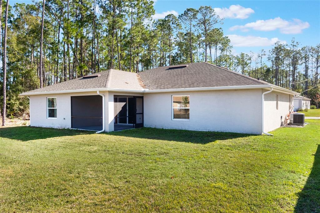 15 Raeland Lane Palm Coast, FL 32164 - Photo 13 of 13 a house view with a garden space
