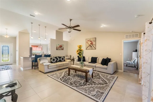 a living room with furniture and a rug
