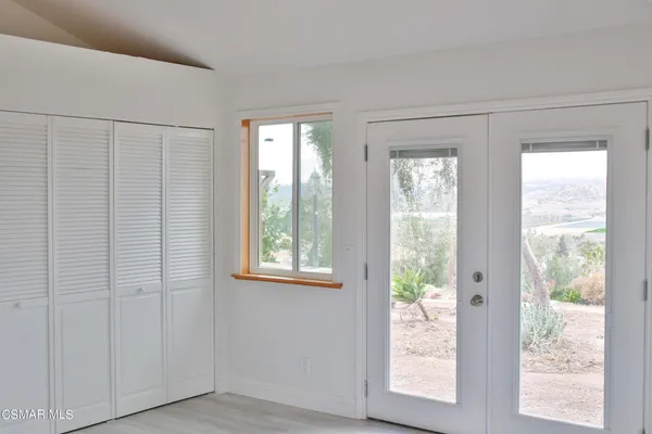 a view of an empty room and window