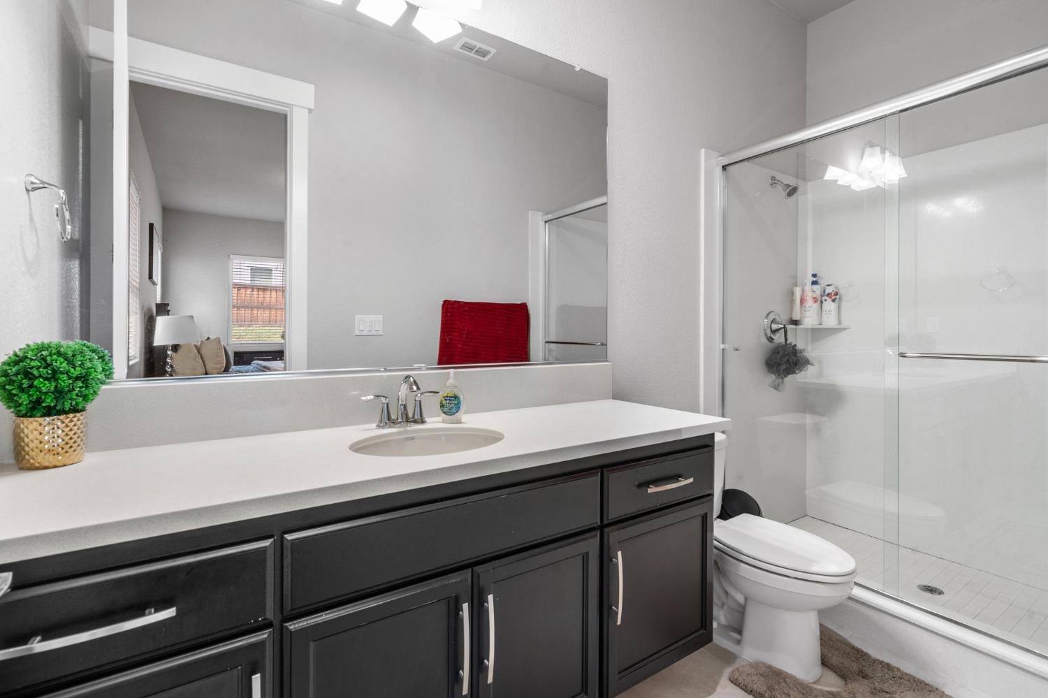 1847 Outrigger Lane Lathrop, CA 95330 - Photo 28 of 54 a bathroom with a sink a toilet and shower