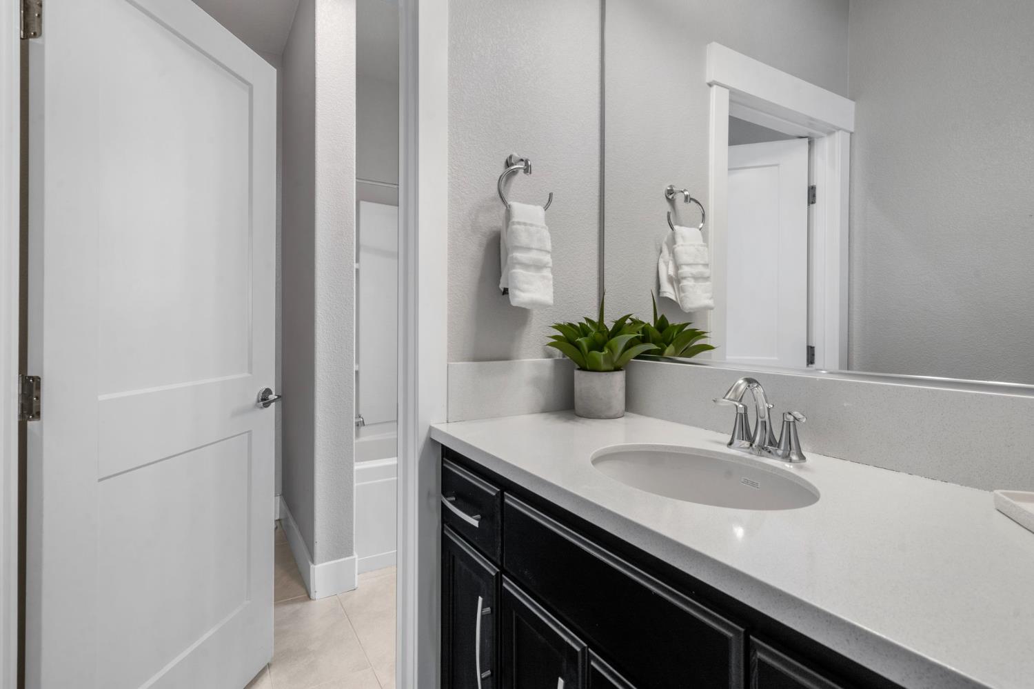 1847 Outrigger Lane Lathrop, CA 95330 - Photo 43 of 54 a bathroom with a sink and a mirror