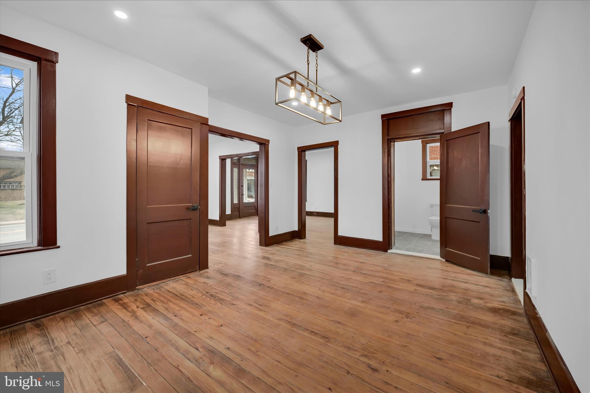 2132 Main Street Lititz, PA 17543 - Photo 11 of 44 a view of an empty room with wooden floor and a window