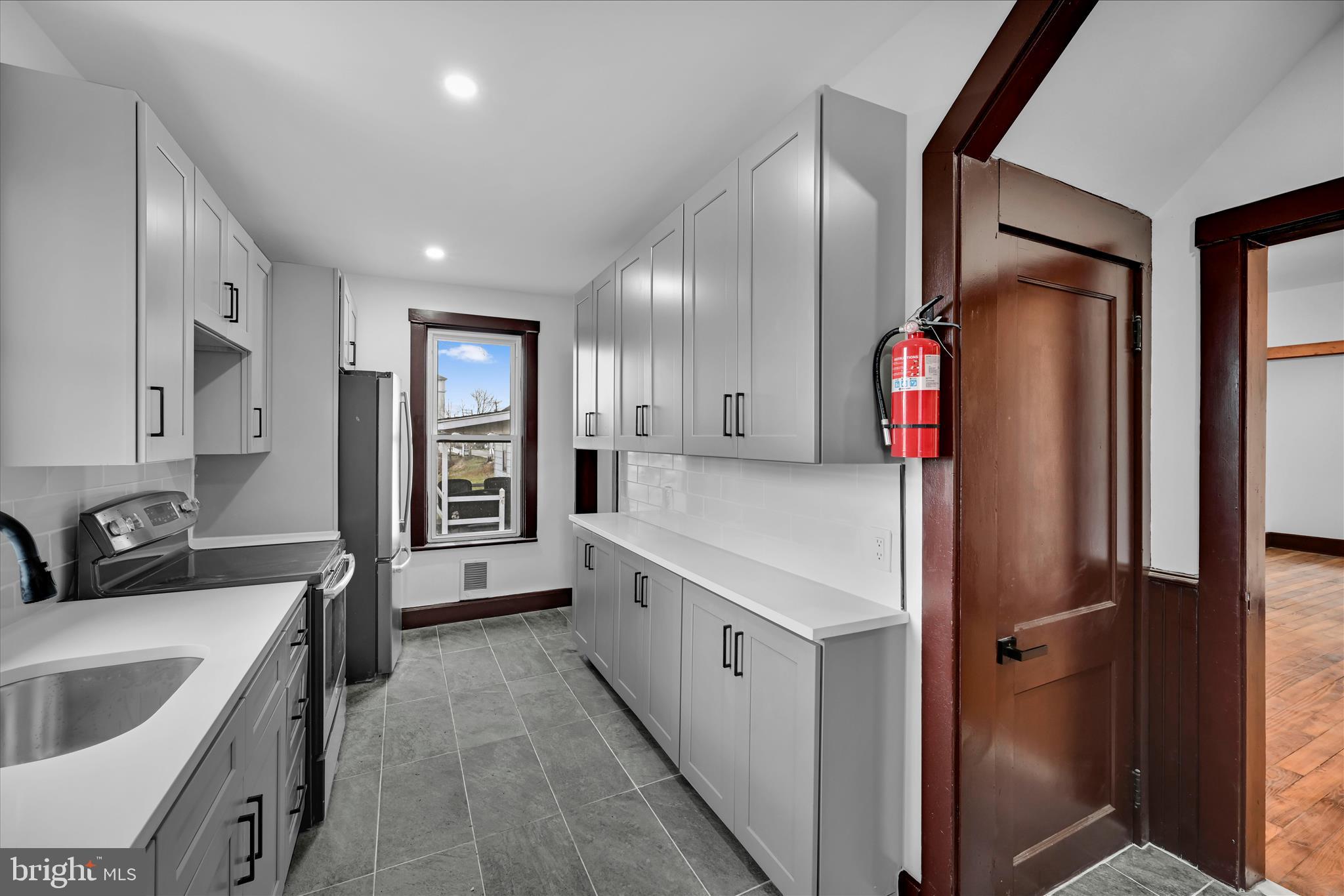 2132 Main Street Lititz, PA 17543 - Photo 12 of 44 a kitchen with white cabinets and stainless steel appliances