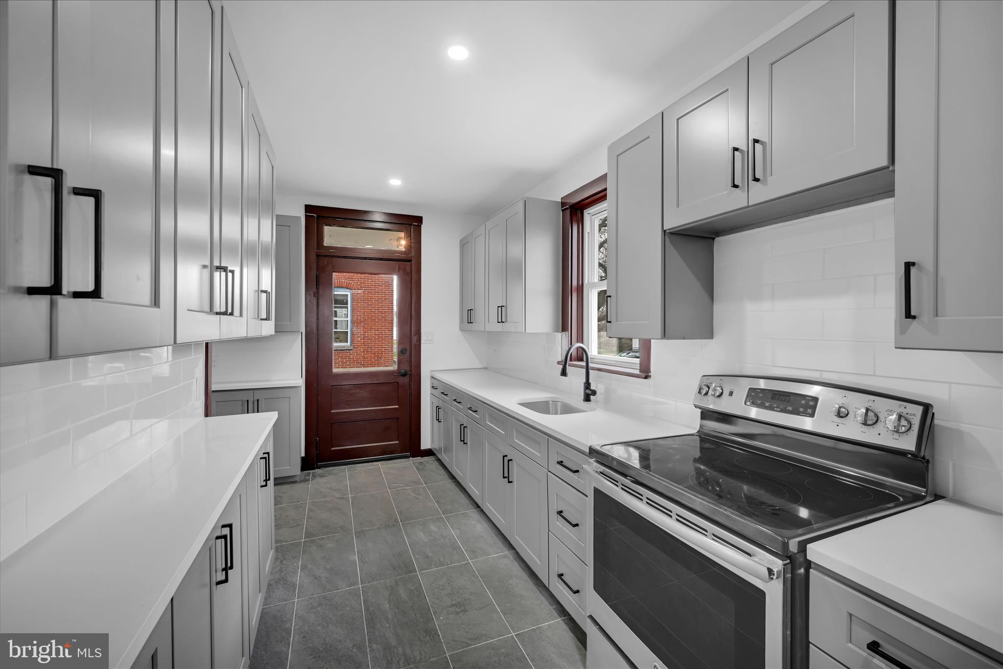 2132 Main Street Lititz, PA 17543 - Photo 14 of 44 a large kitchen with a stove and a sink