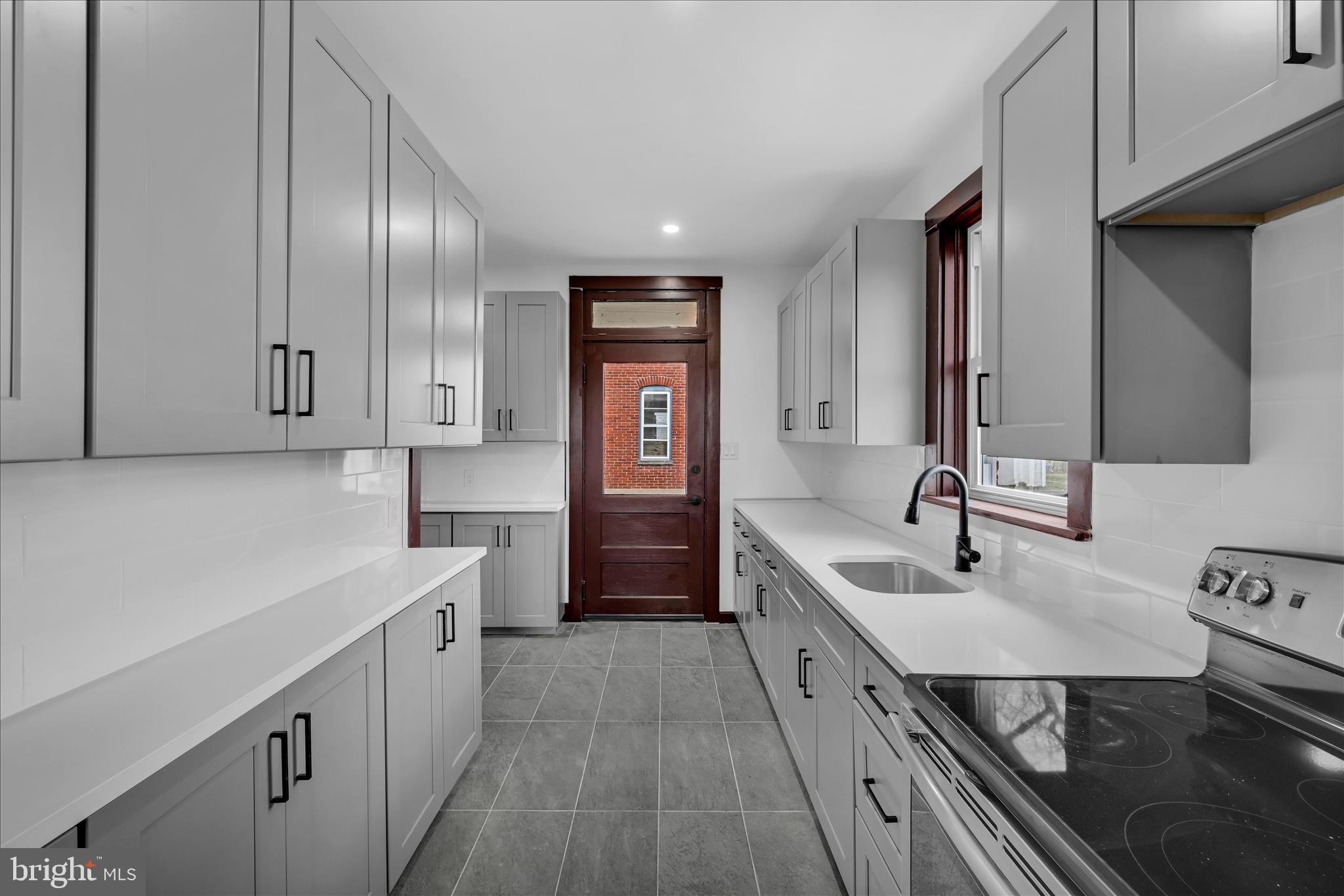 2132 Main Street Lititz, PA 17543 - Photo 15 of 44 a kitchen with stainless steel appliances a sink stove and cabinets