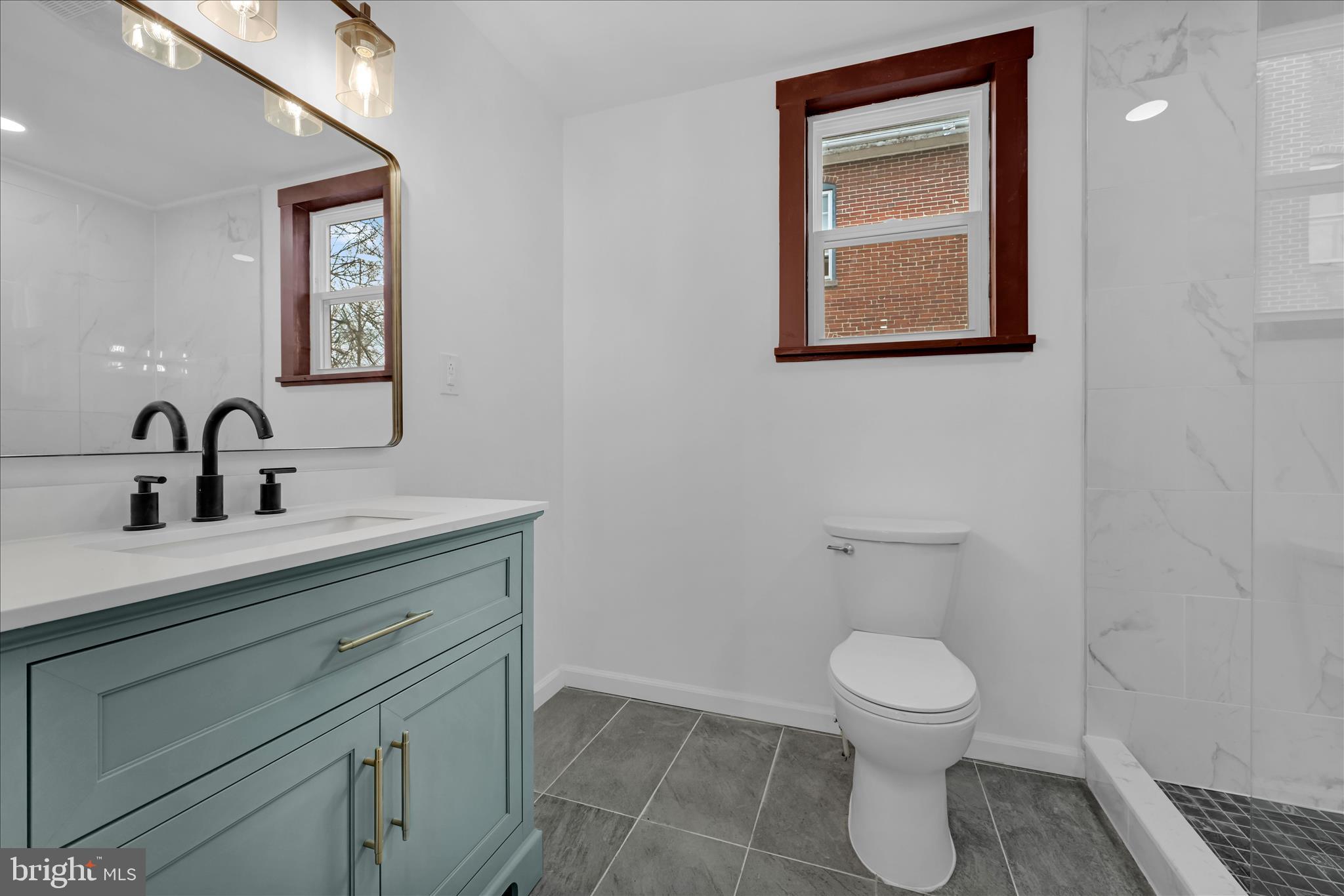 2132 Main Street Lititz, PA 17543 - Photo 16 of 44 a bathroom with a toilet sink and mirror