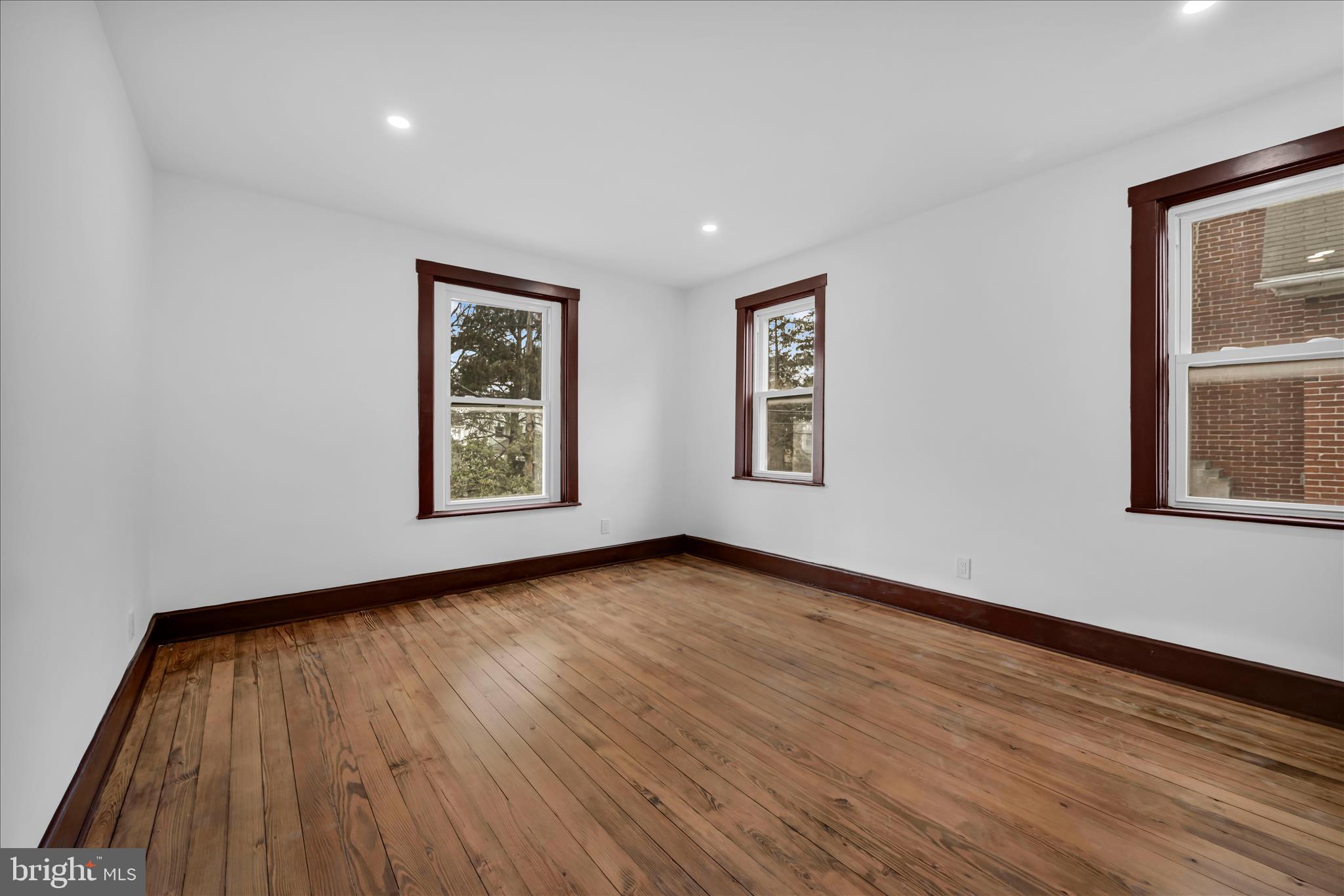 2132 Main Street Lititz, PA 17543 - Photo 18 of 44 a view of an empty room with wooden floor and a window