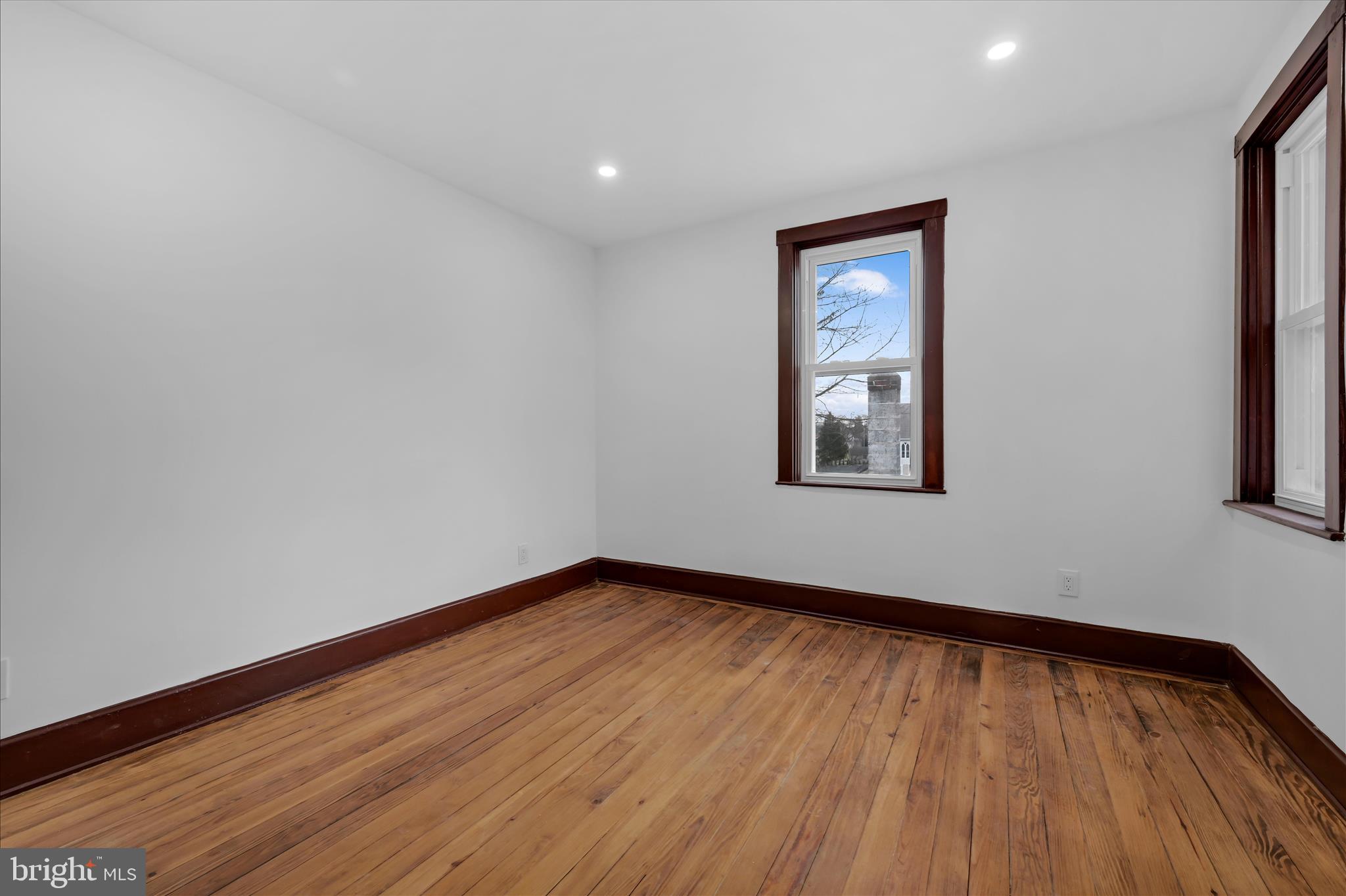 2132 Main Street Lititz, PA 17543 - Photo 23 of 44 a view of an empty room with wooden floor and a window