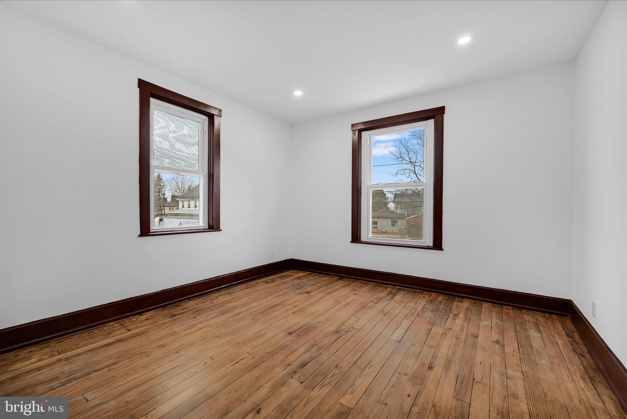 2132 Main Street Lititz, PA 17543 - Photo 31 of 44 a view of an empty room with window and wooden floor
