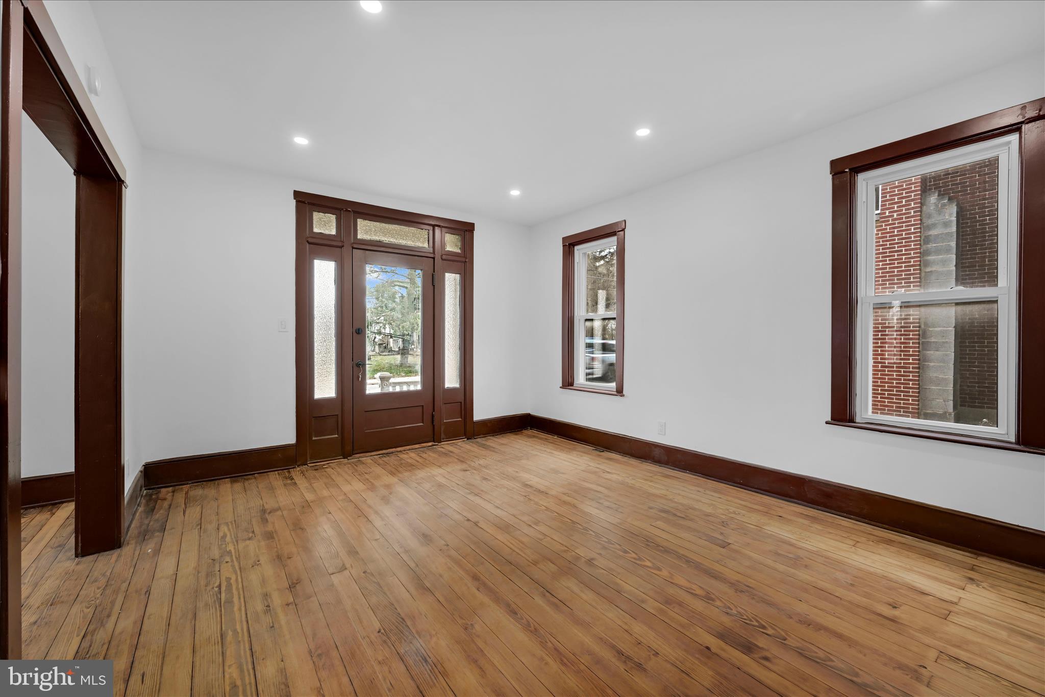 2132 Main Street Lititz, PA 17543 - Photo 4 of 44 a view of an empty room with wooden floor and window