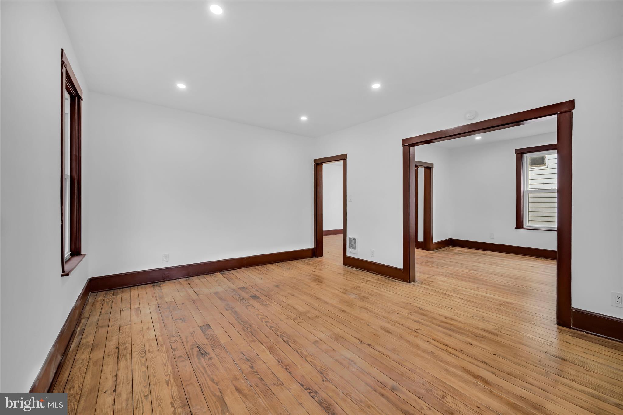 2132 Main Street Lititz, PA 17543 - Photo 6 of 44 a view of an empty room with wooden floor and a window