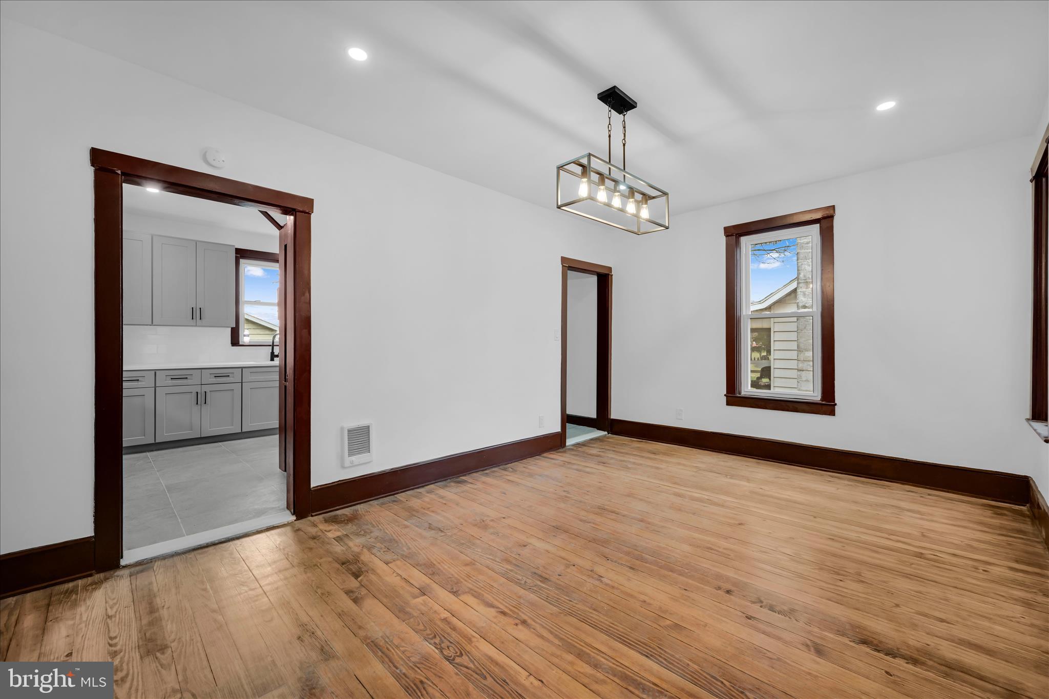 2132 Main Street Lititz, PA 17543 - Photo 9 of 44 a view of an empty room with glass door and wooden floor