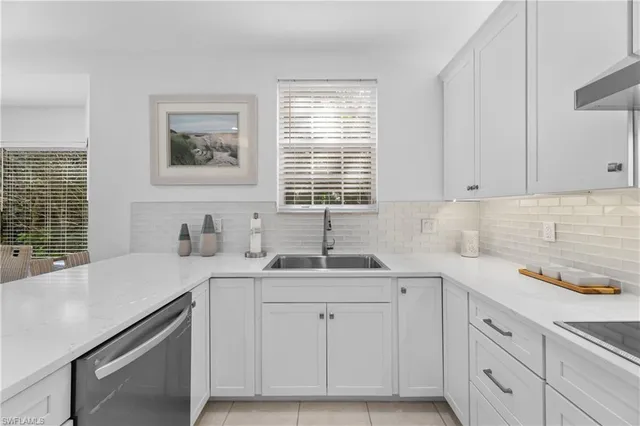 a kitchen with sink cabinets and window
