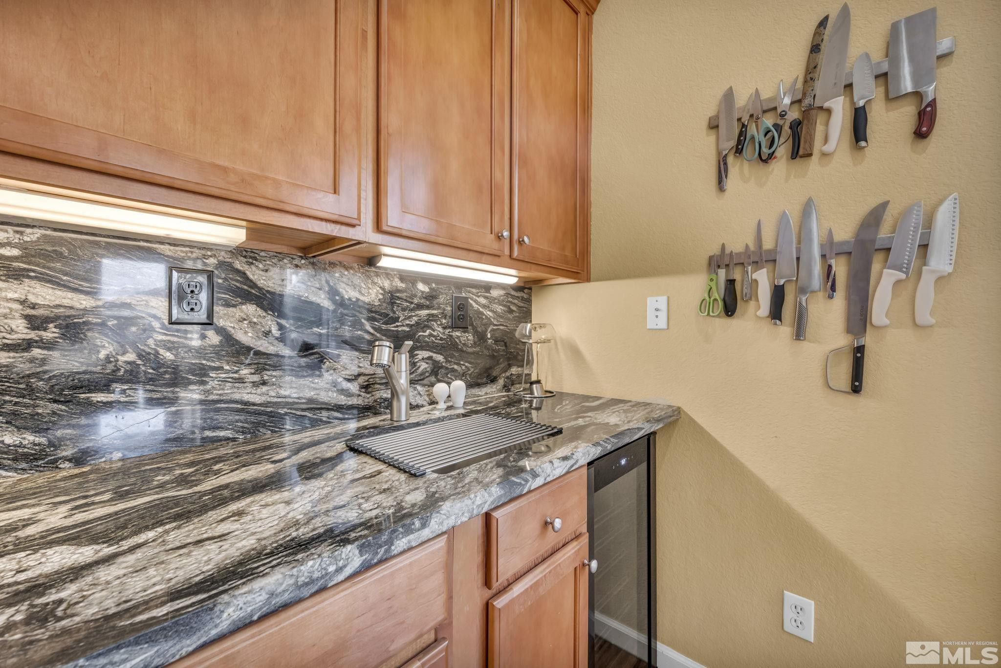 10655 Autumn Walk Lane Reno, NV 89521 - Photo 12 of 40 a bathroom with a granite countertop sink and a mirror