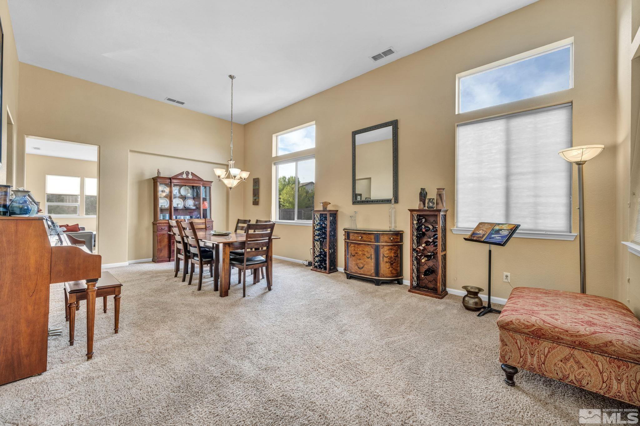 10655 Autumn Walk Lane Reno, NV 89521 - Photo 15 of 40 a living room with furniture and a dining table