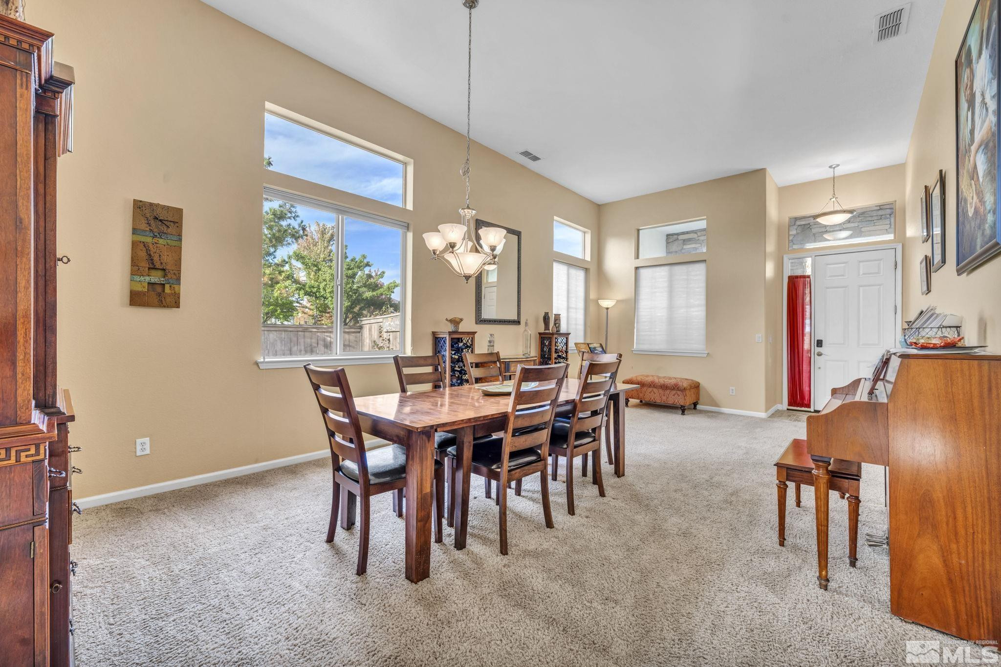 10655 Autumn Walk Lane Reno, NV 89521 - Photo 16 of 40 a view of a dining room with furniture window and outside view
