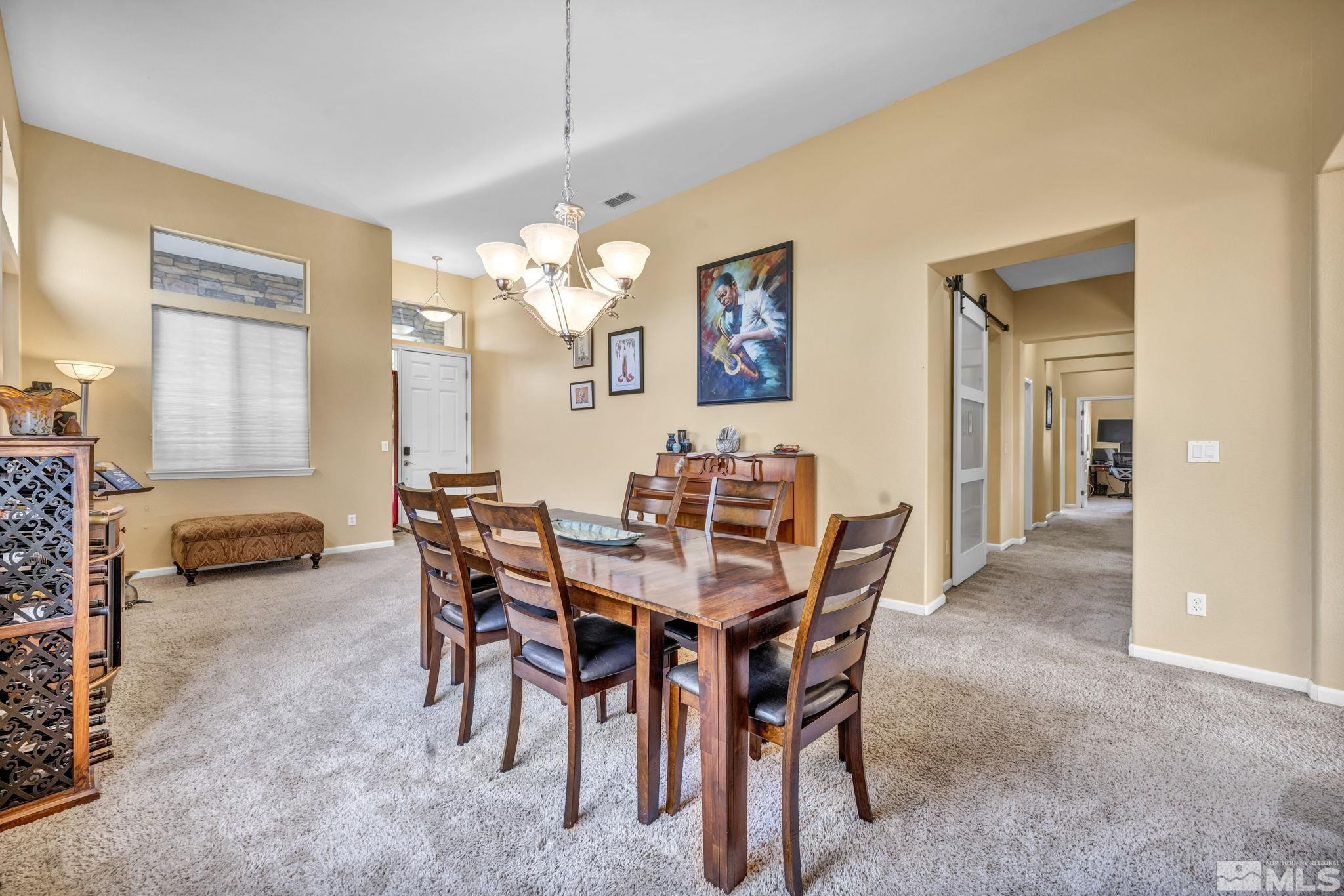 10655 Autumn Walk Lane Reno, NV 89521 - Photo 17 of 40 a view of a dining room with furniture and chandelier