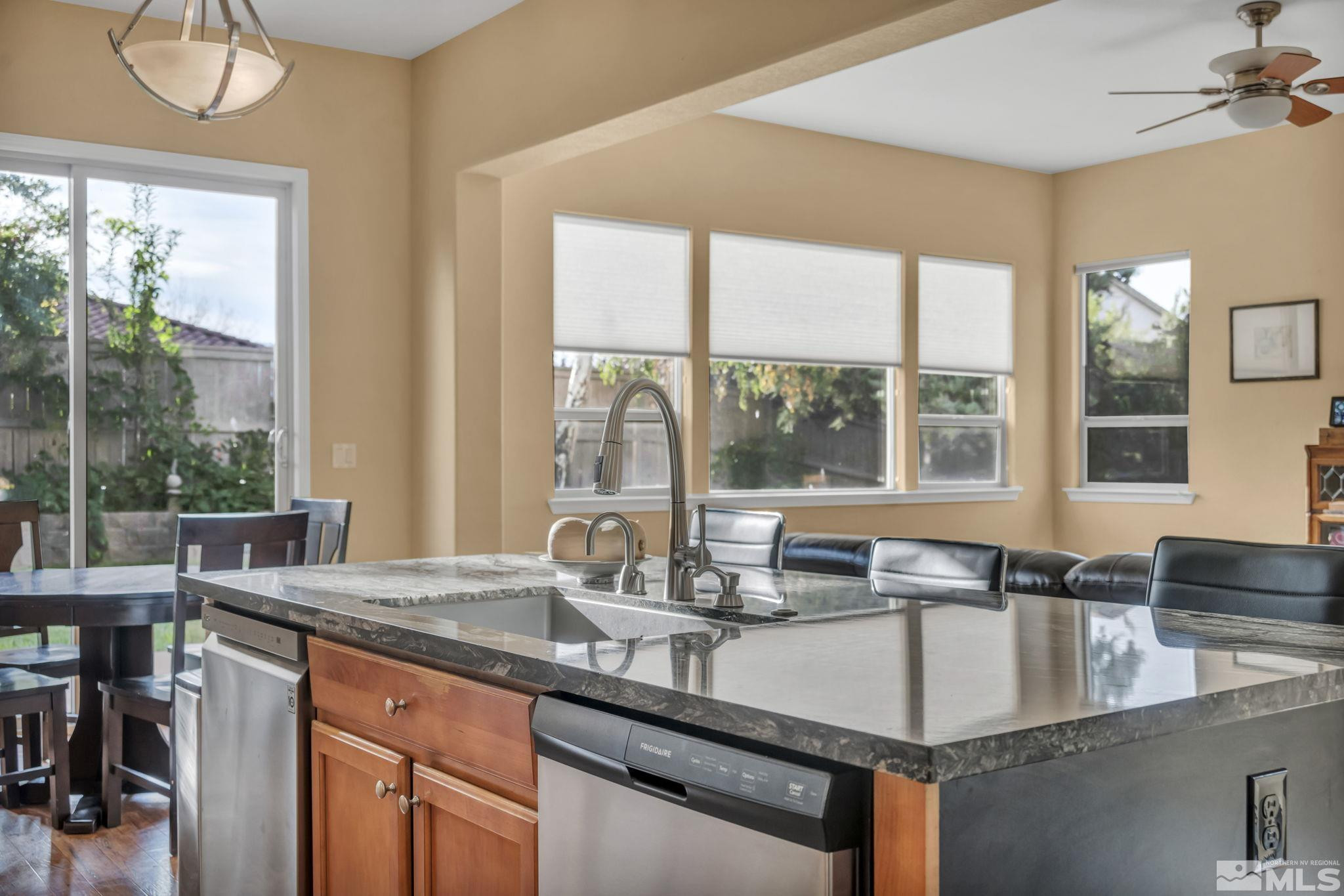 10655 Autumn Walk Lane Reno, NV 89521 - Photo 2 of 40 a kitchen with granite countertop a sink and a window