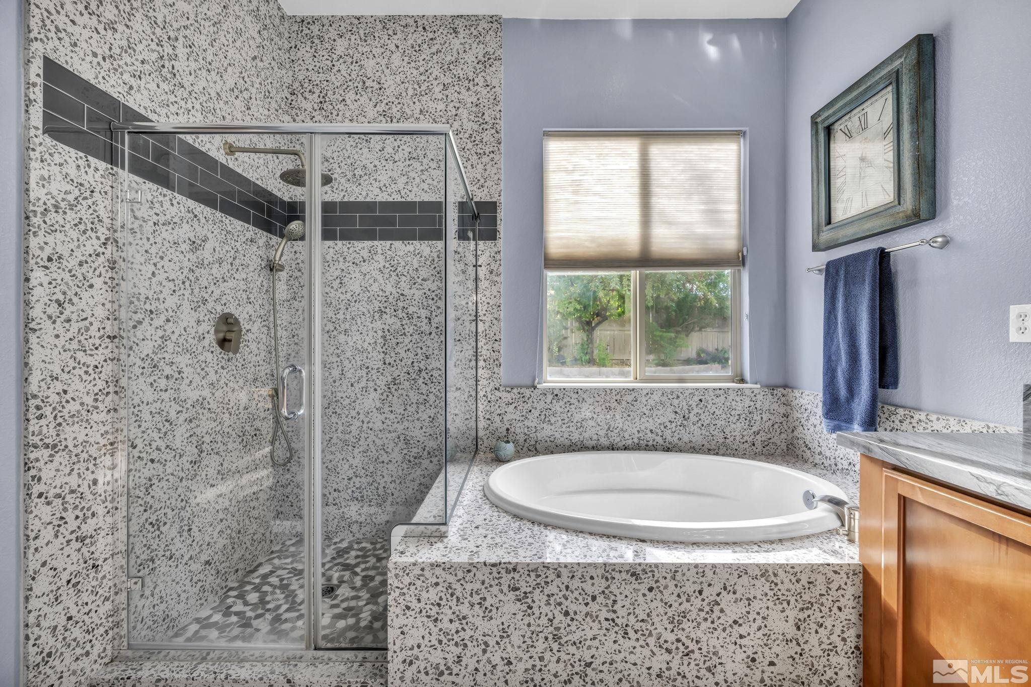 10655 Autumn Walk Lane Reno, NV 89521 - Photo 21 of 40 a bathroom with a granite countertop shower a window and a sink