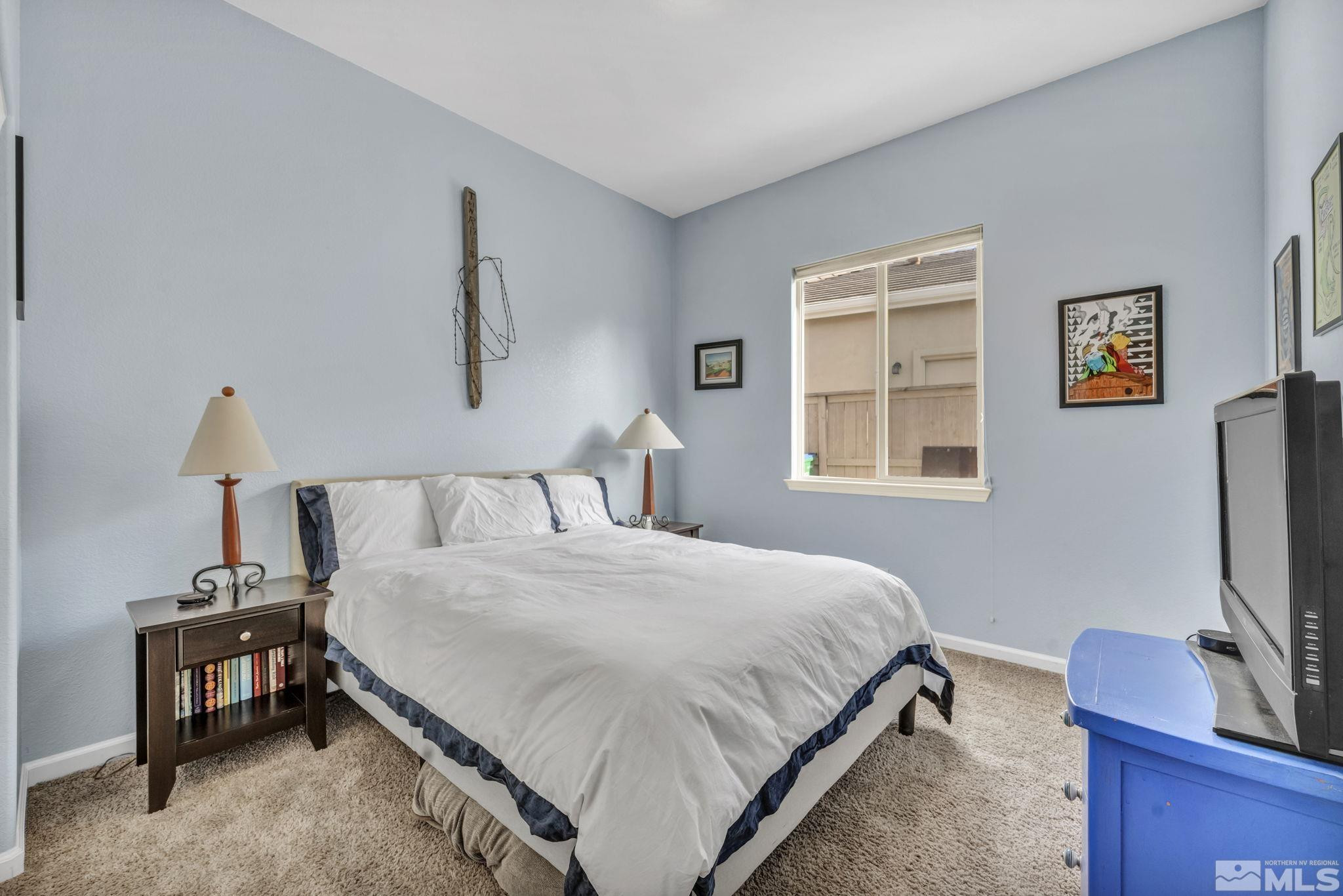 10655 Autumn Walk Lane Reno, NV 89521 - Photo 26 of 40 a bedroom with a bed table chair and a window