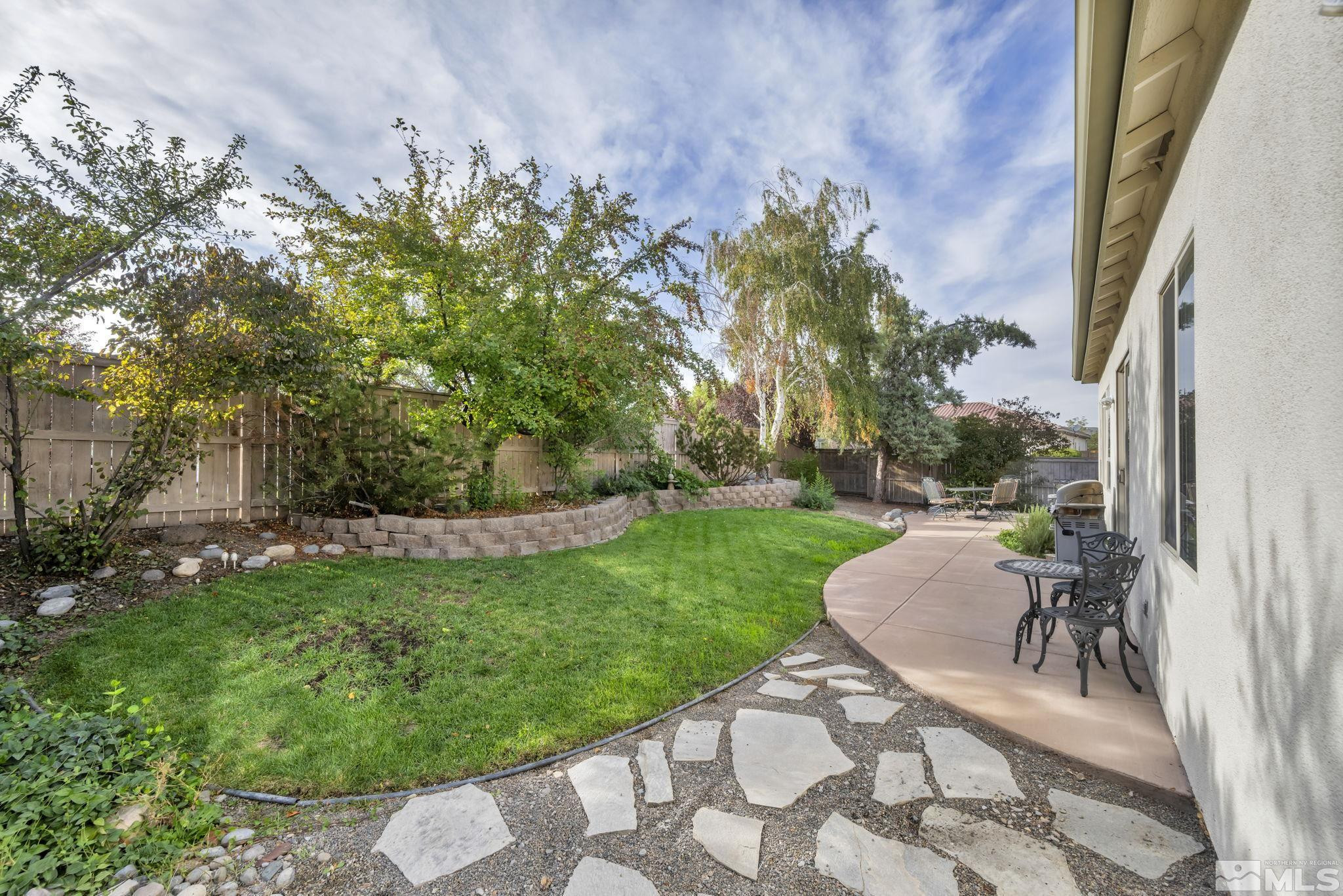 10655 Autumn Walk Lane Reno, NV 89521 - Photo 29 of 40 a view of a backyard with sitting area