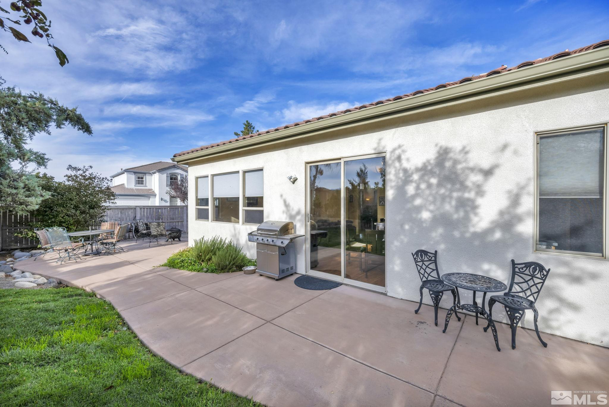 10655 Autumn Walk Lane Reno, NV 89521 - Photo 33 of 40 a front view of a house with garden and outdoor seating