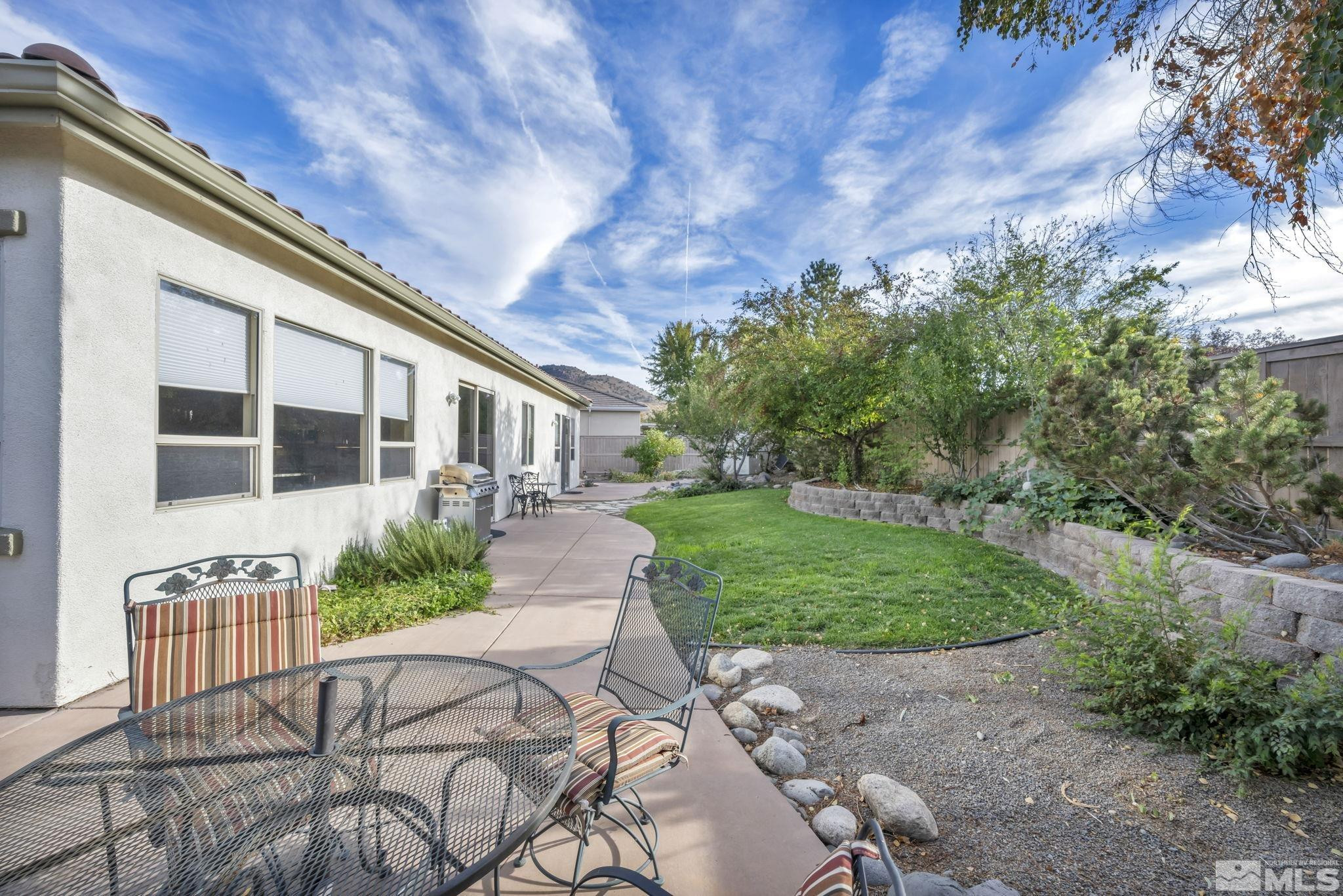 10655 Autumn Walk Lane Reno, NV 89521 - Photo 34 of 40 a front view of a house with garden