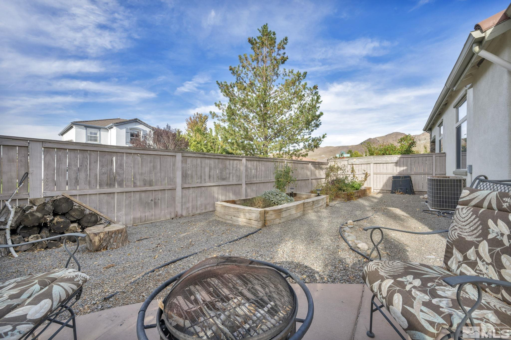 10655 Autumn Walk Lane Reno, NV 89521 - Photo 35 of 40 a view of a backyard with sitting area