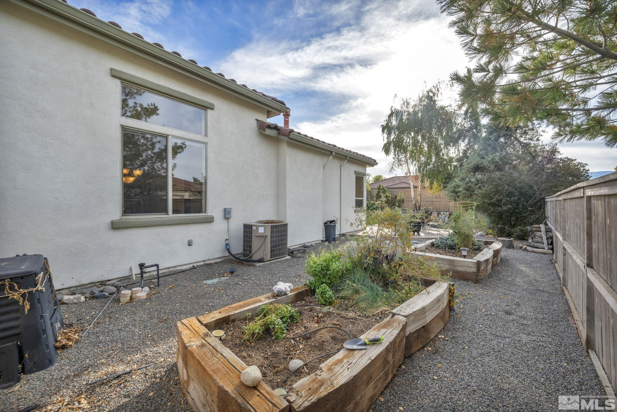 10655 Autumn Walk Lane Reno, NV 89521 - Photo 36 of 40 a front view of a house with garden