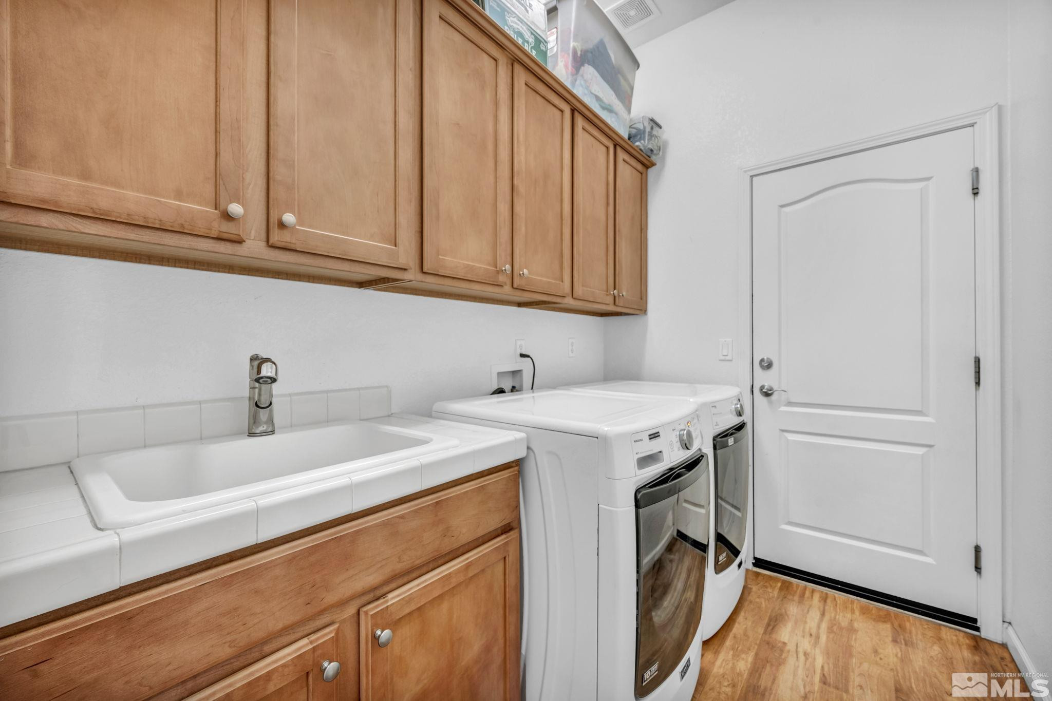 10655 Autumn Walk Lane Reno, NV 89521 - Photo 38 of 40 a utility room with sink dryer and washer