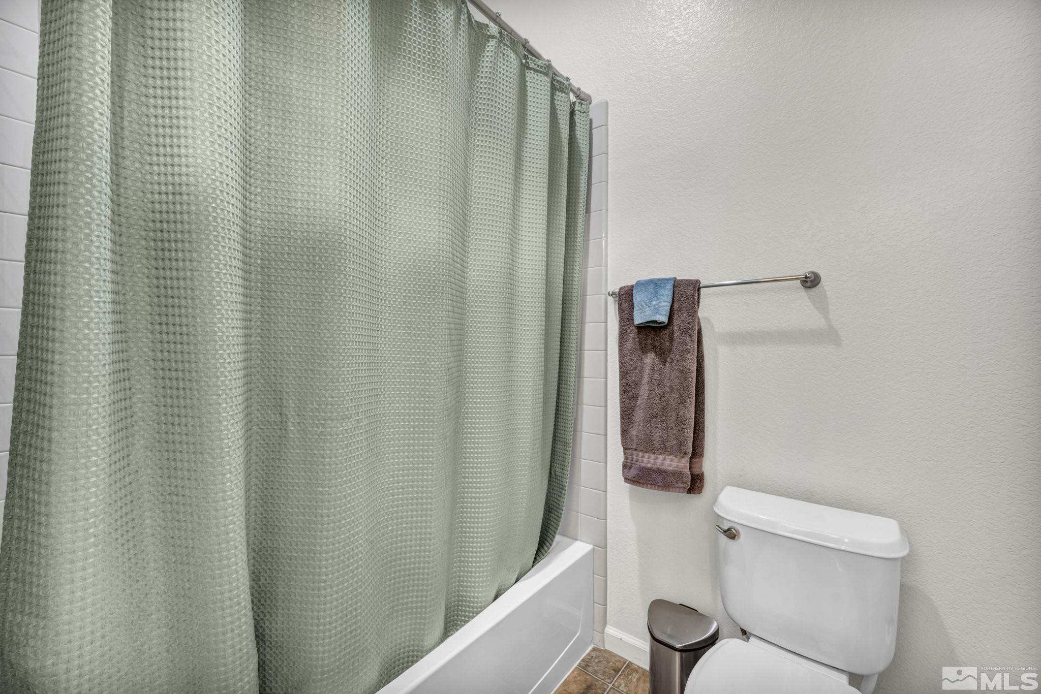 10655 Autumn Walk Lane Reno, NV 89521 - Photo 40 of 40 a bathroom with a shower curtain